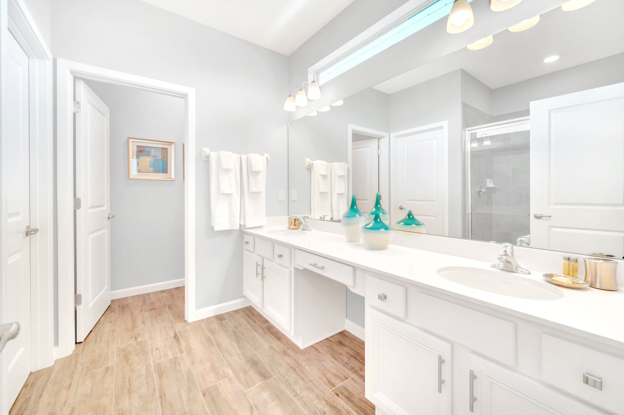 Bright And Functional Bathroom With A Shower And Vanity Space