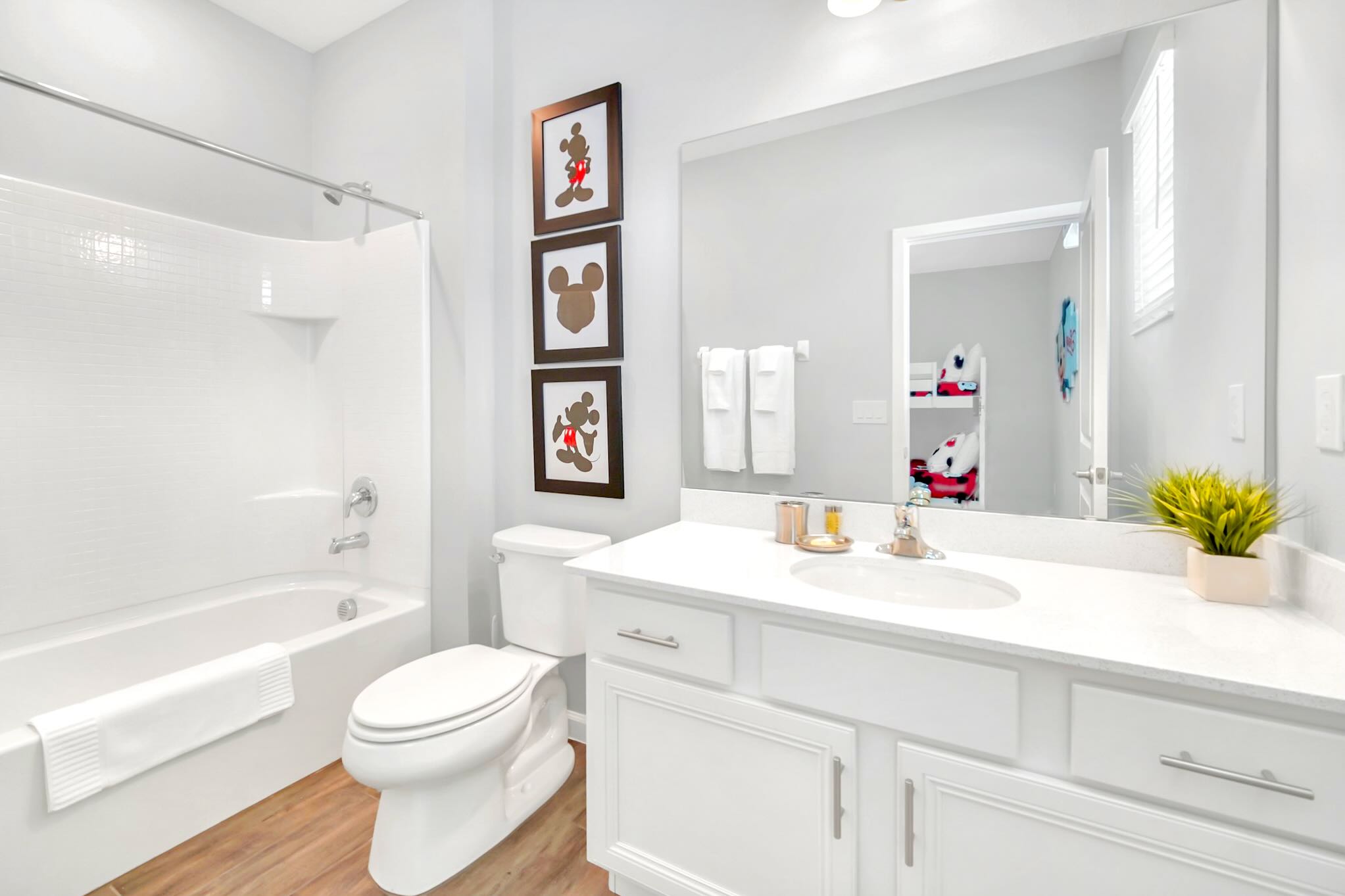 Bright And Functional Bathroom With A Shower And Vanity Space