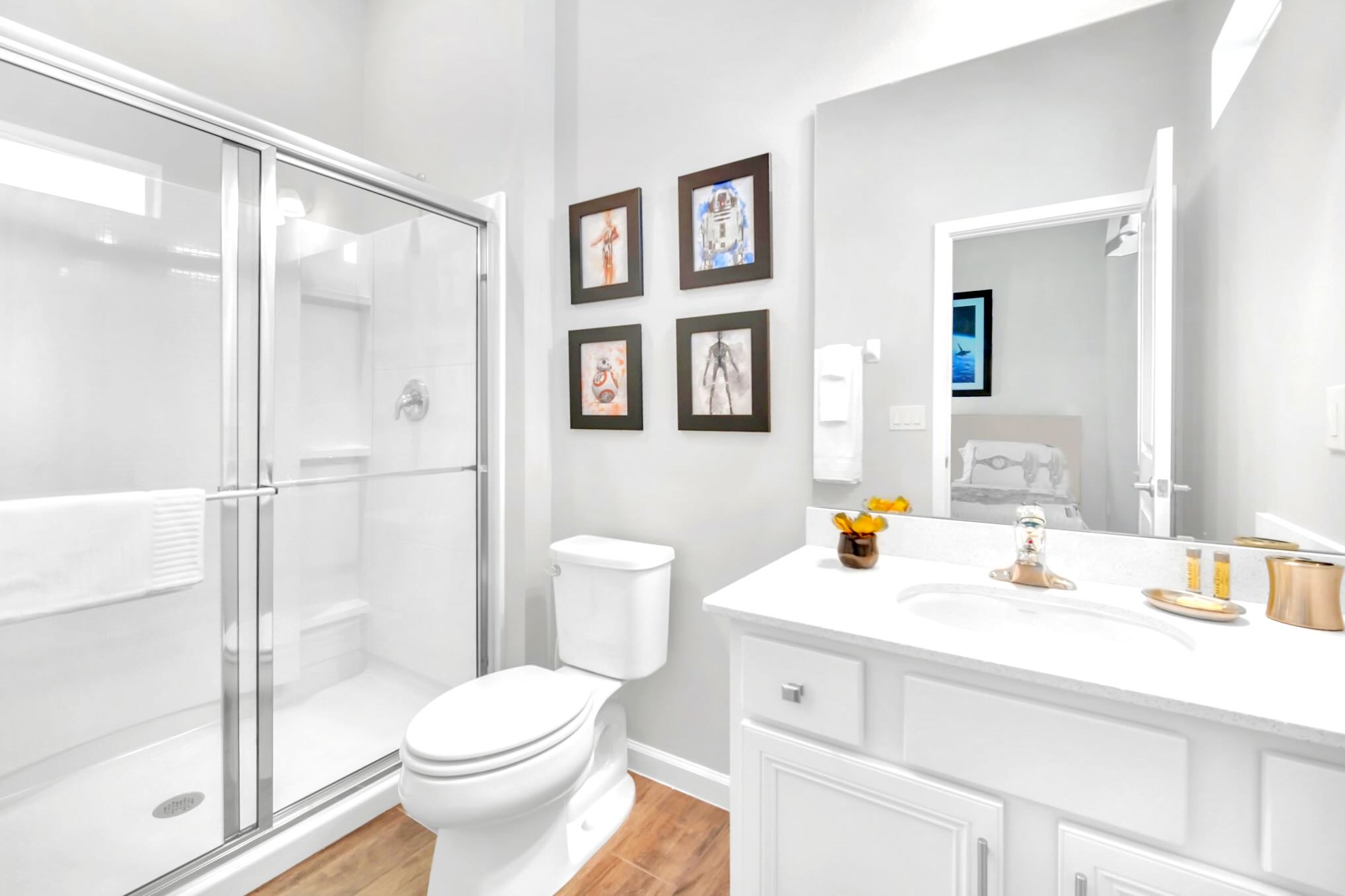 Bright And Functional Bathroom With A Shower And Vanity Space