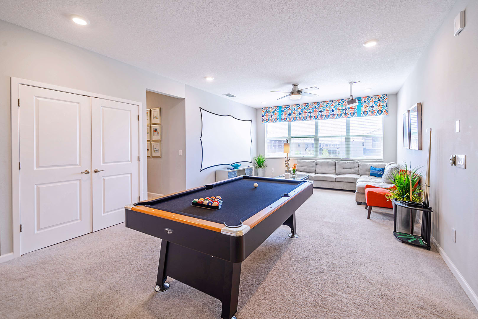 Massive projection screen and billiards table in the upstairs lounge