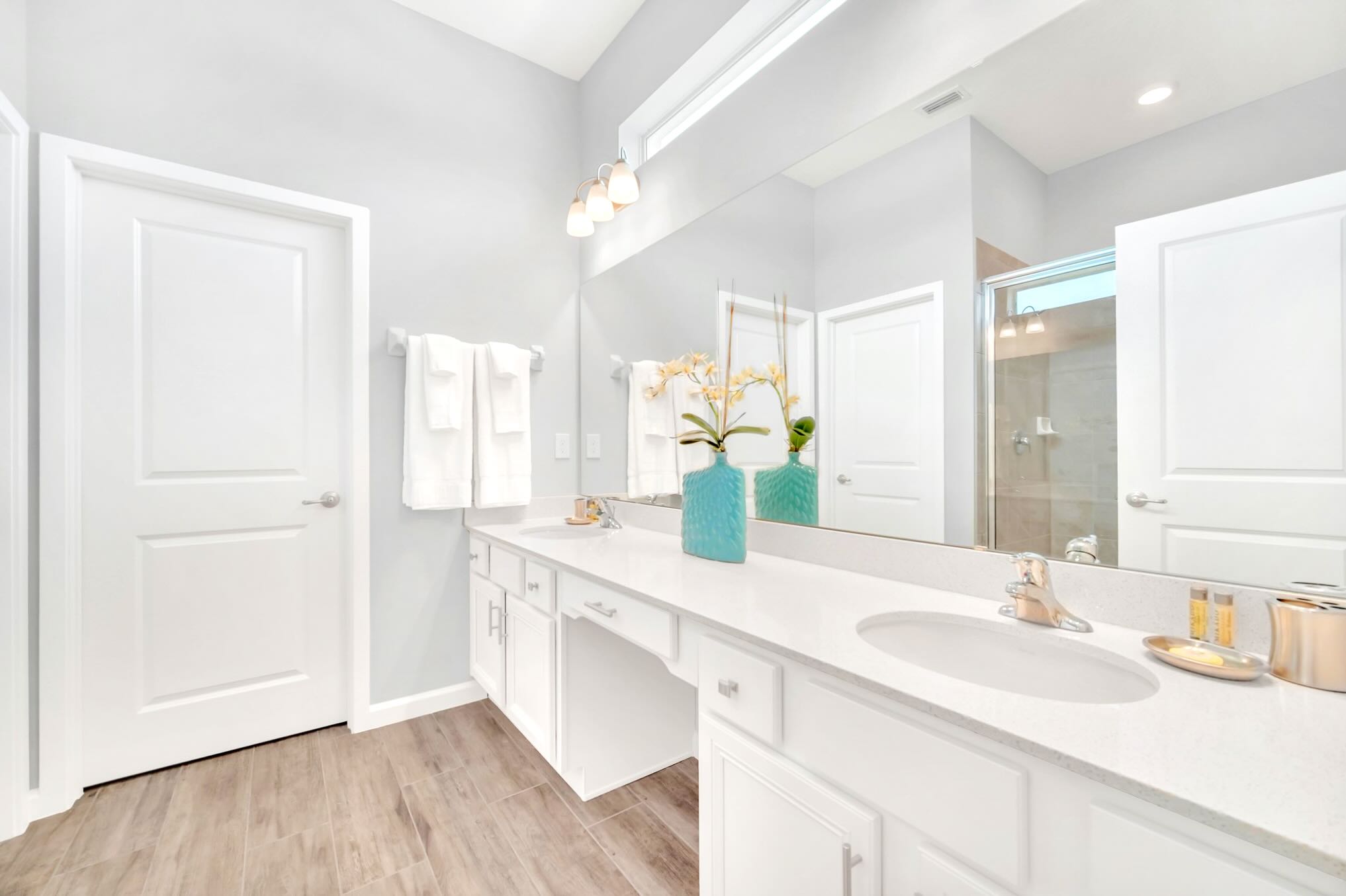 Bright And Functional Bathroom With A Shower And Vanity Space