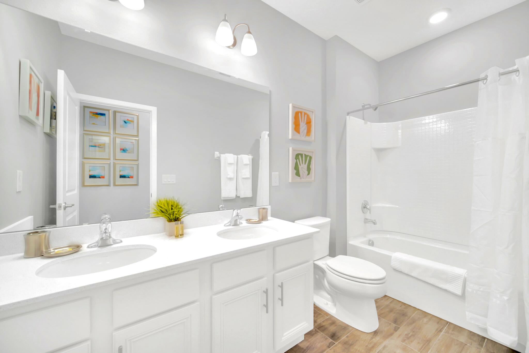 Bright And Functional Bathroom With A Shower And Vanity Space