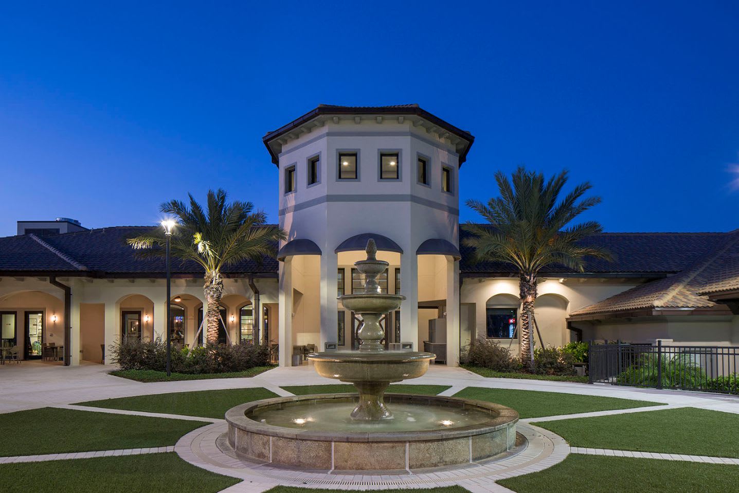 Elegant Clubhouse Entrance Highlighted By A Beautiful Fountain