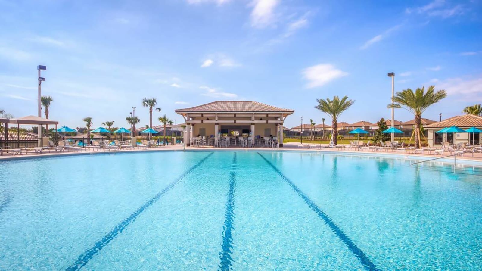 Expansive Resort Pool Perfect For Sunbathing And Swimming