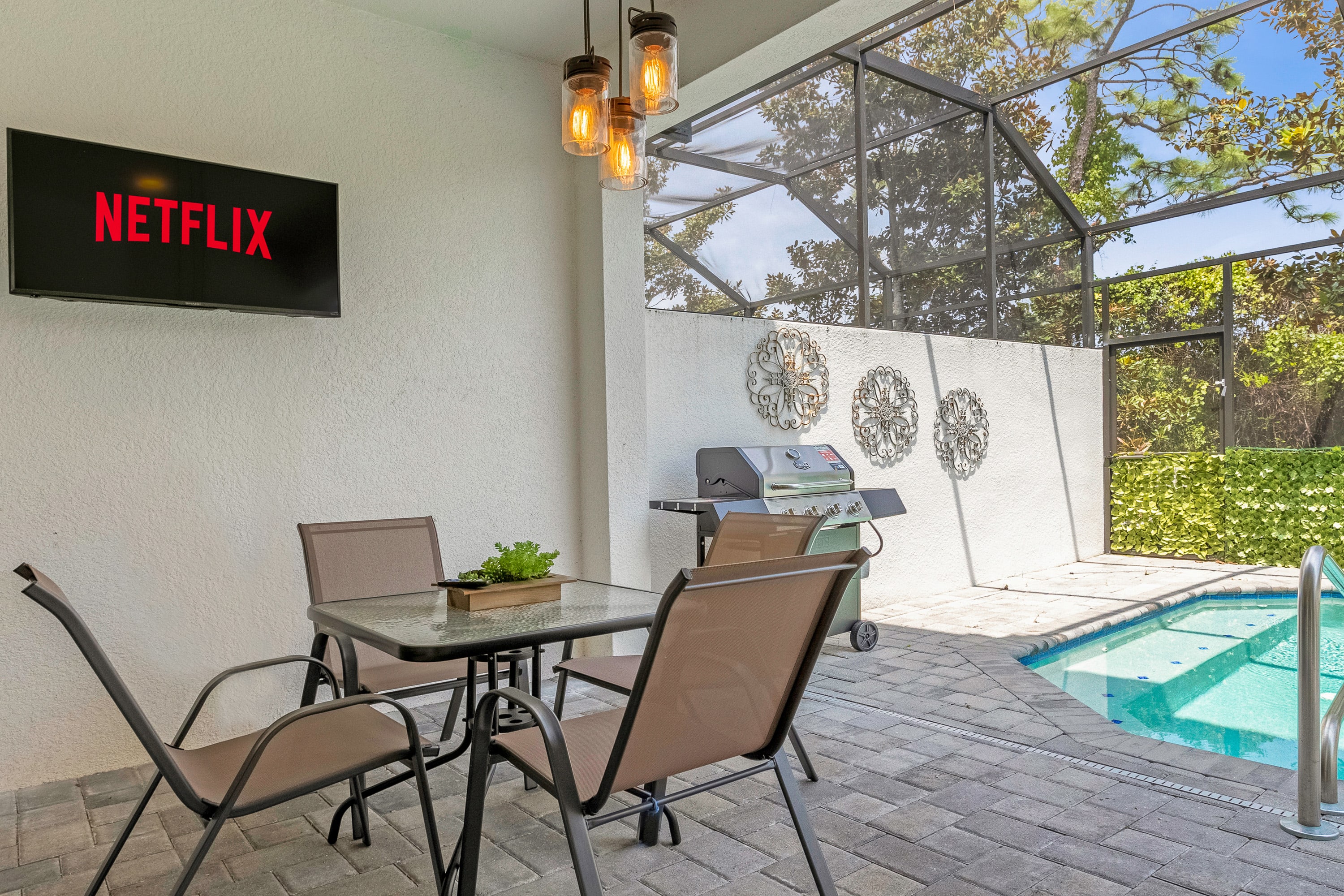Outdoor Dining Area with Wall Mounted TV