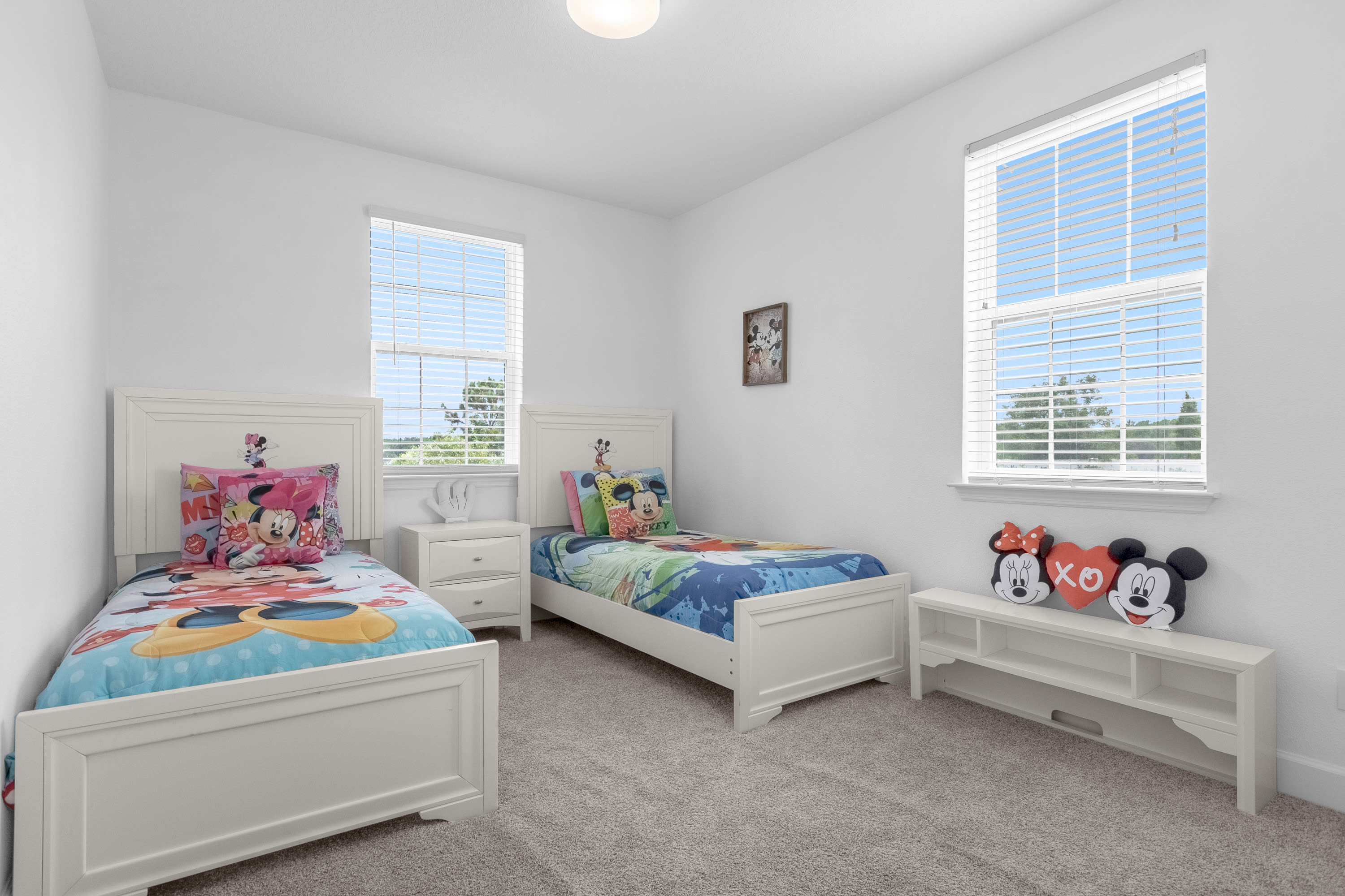 Fun Kids' Room With Twin Beds And Colorful Bedding