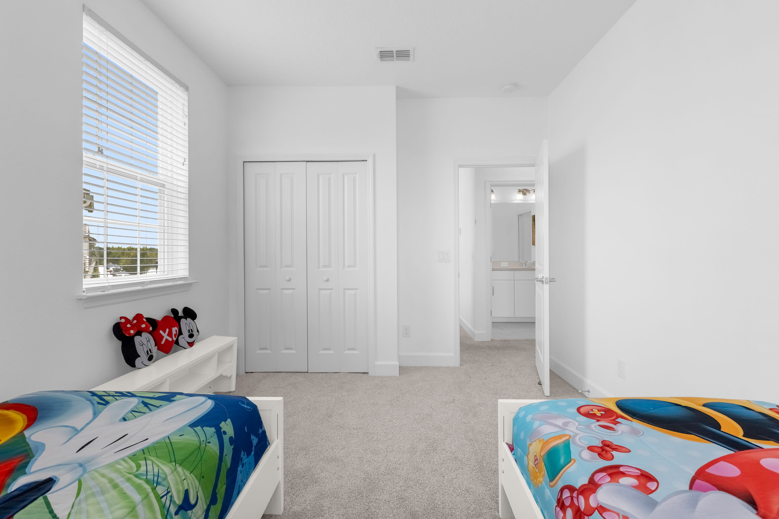 Spacious Kids' Room With Themed Decor And Twin Beds