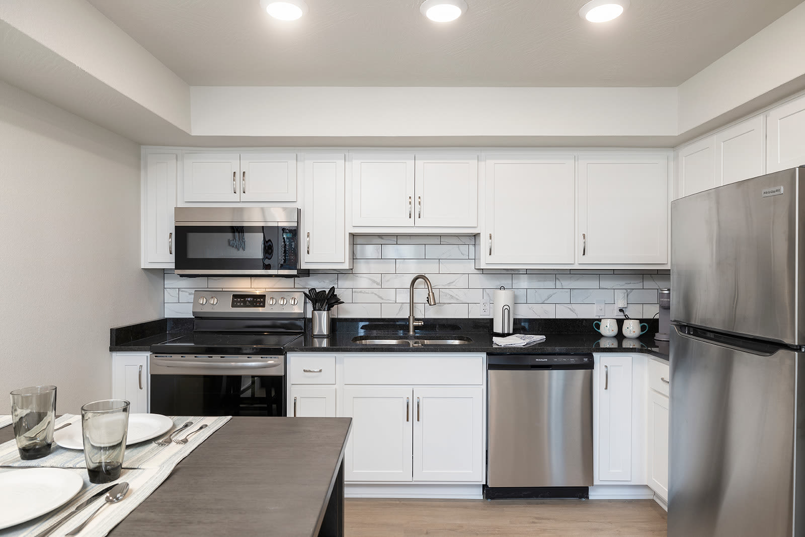 Beautiful dining room and kitchen with custom tile backsplash