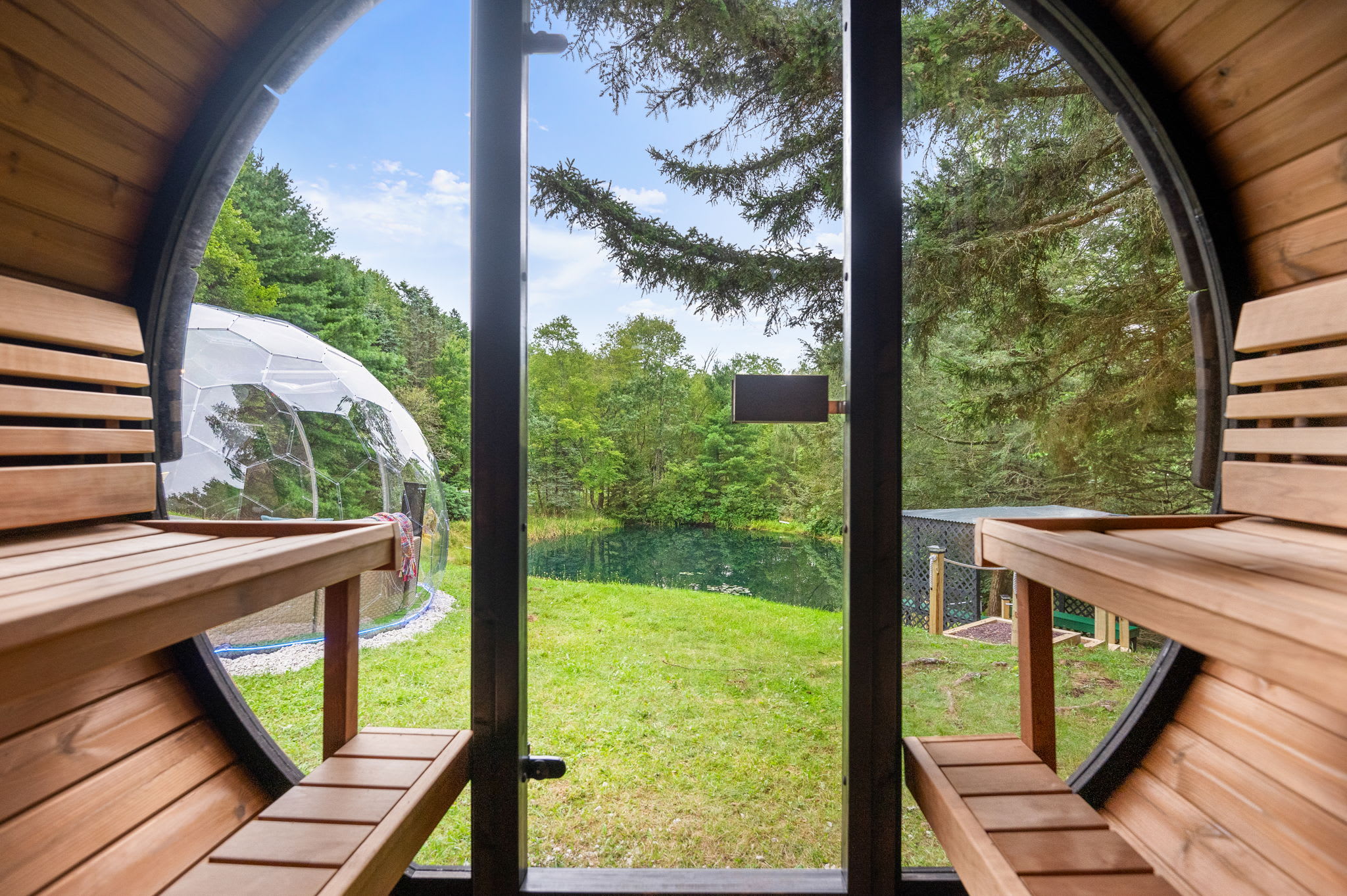 Relax in this beautifully crafted barrel sauna while enjoying peaceful views of the pond and nature around you. The perfect way to unwind and detox.