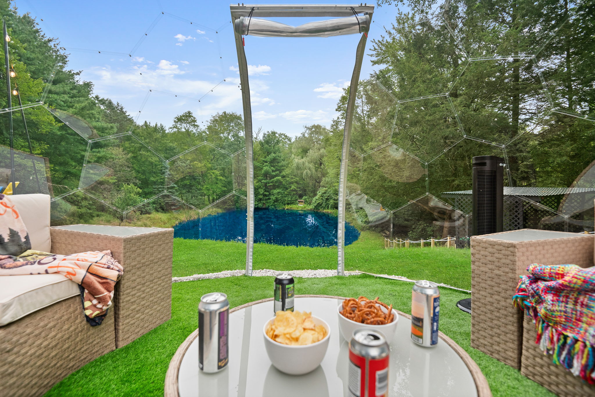 Enjoy the best of nature while staying warm inside this stylish igloo lounge with panoramic views of the property.