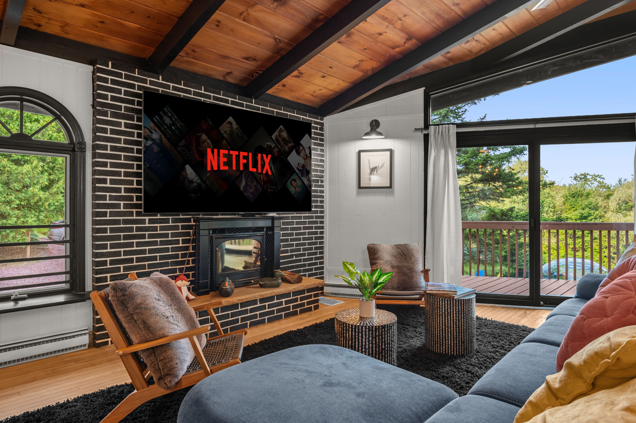 With large windows and an open-concept design, this living room blends indoor comfort with stunning outdoor scenery.