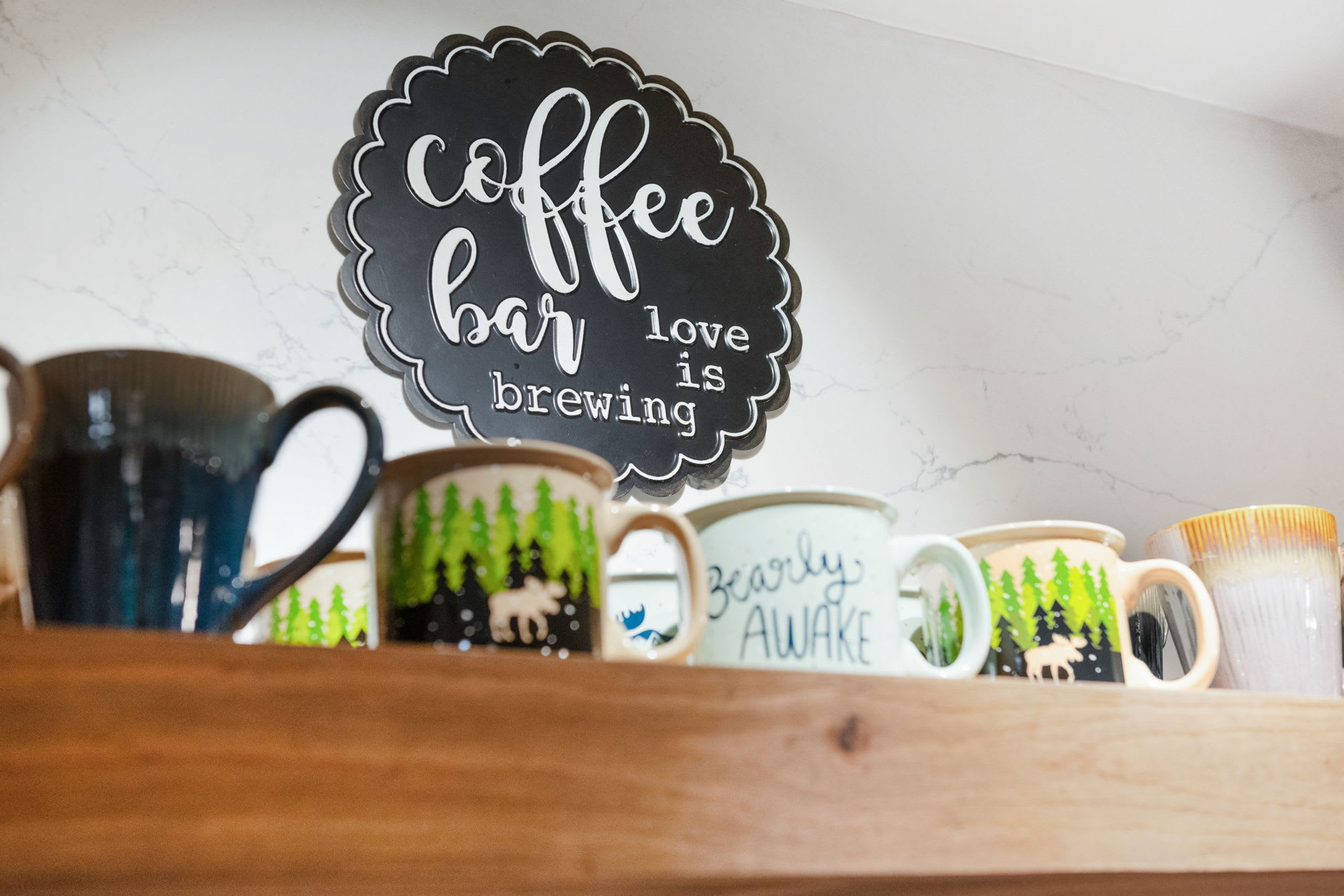 Start your day with a fresh brew from our cozy coffee bar, complete with a charming collection of mugs for every mood.