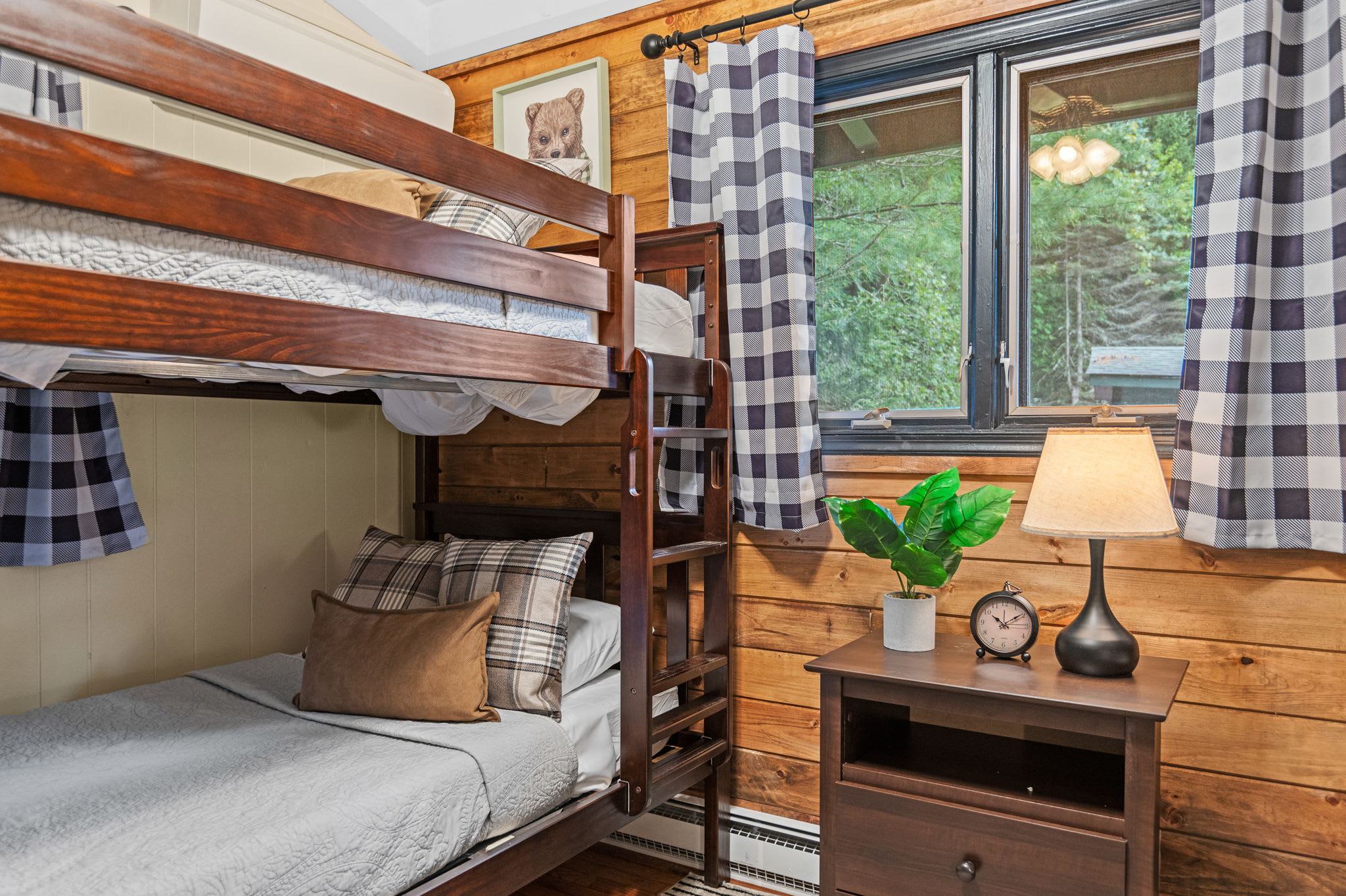 This cozy bunk room combines warm wood accents and modern comfort, making it the perfect space for kids and friends to unwind.