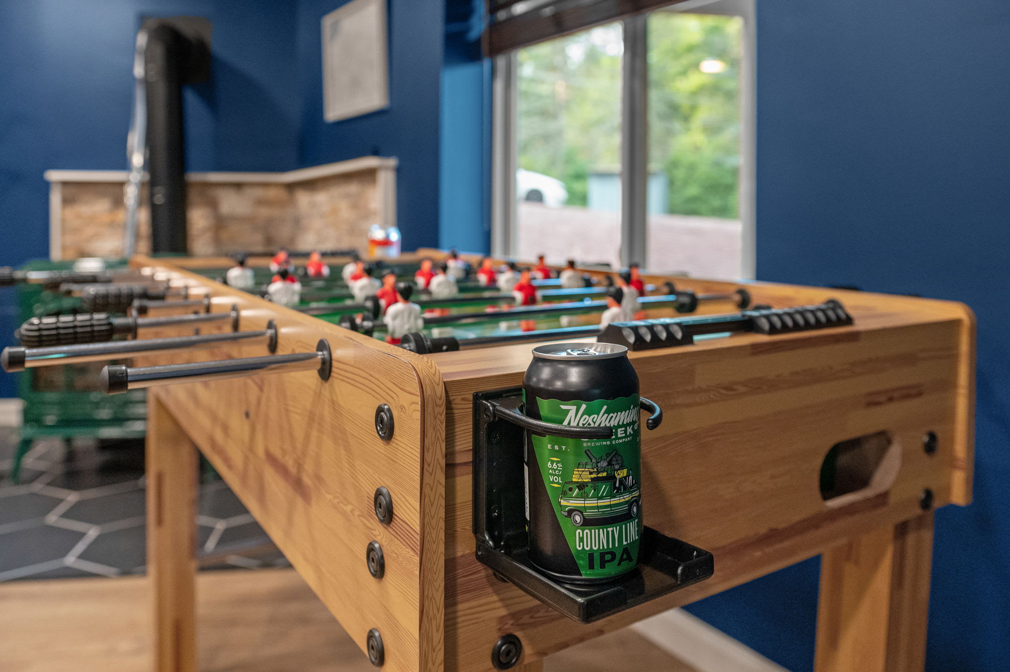 Challenge your friends to a match while keeping your favorite drink within reach, all in a space built for endless entertainment.