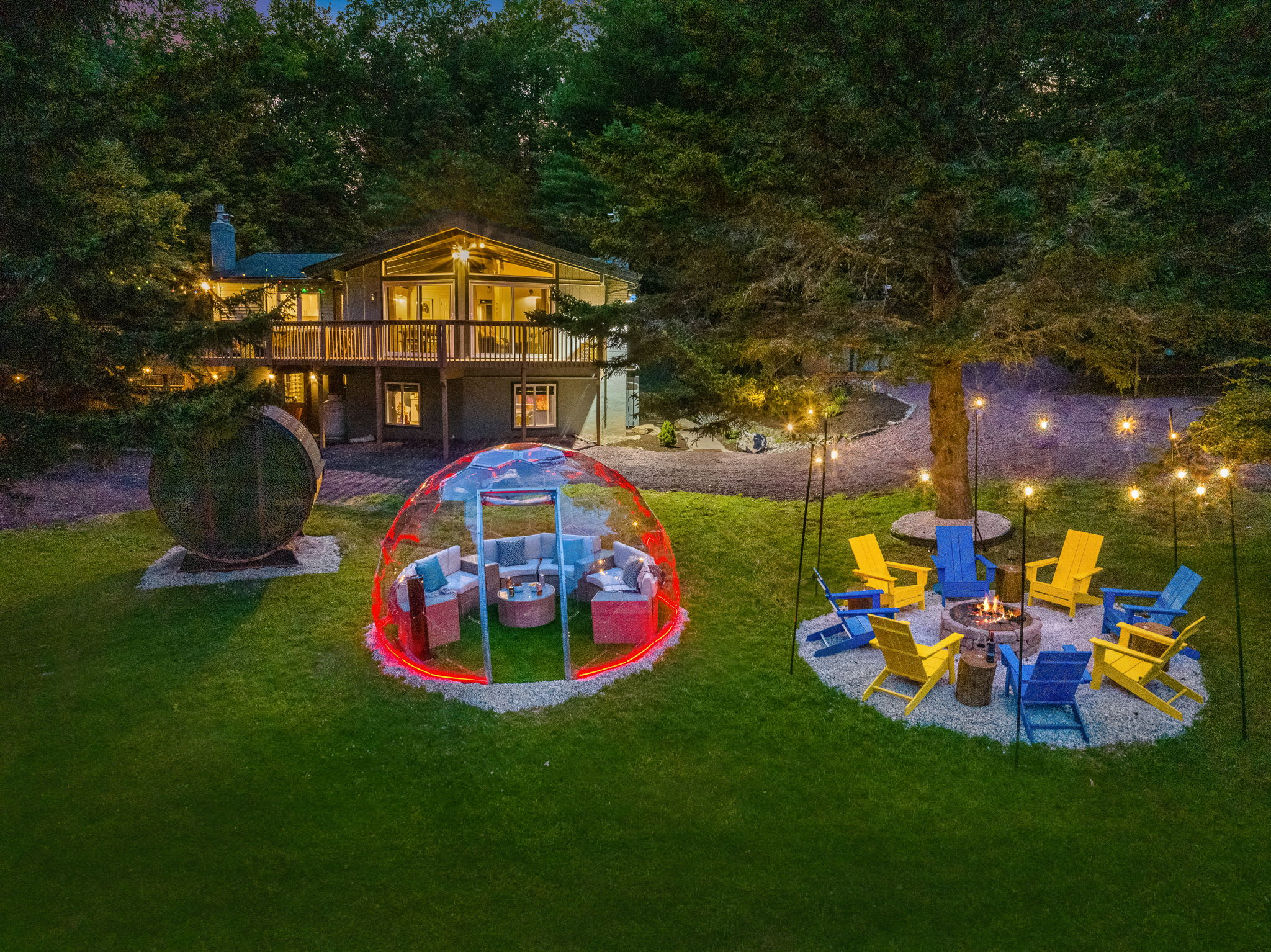  Immerse yourself in the magic of this stunning backyard retreat. With a glowing dome lounge, a cozy fire pit, and a charming sauna, your evenings will be unforgettable.