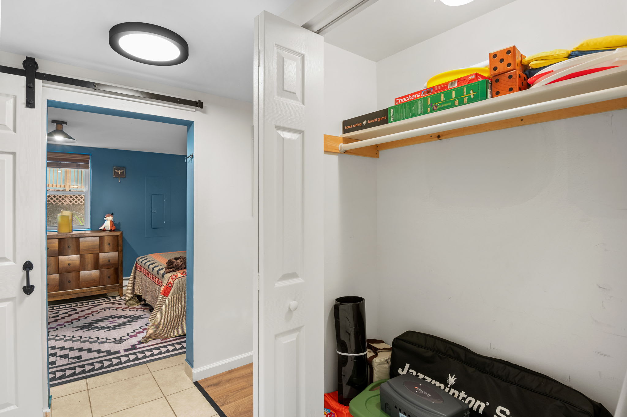 Store your belongings with ease in this thoughtfully designed storage area, complete with games and essentials.