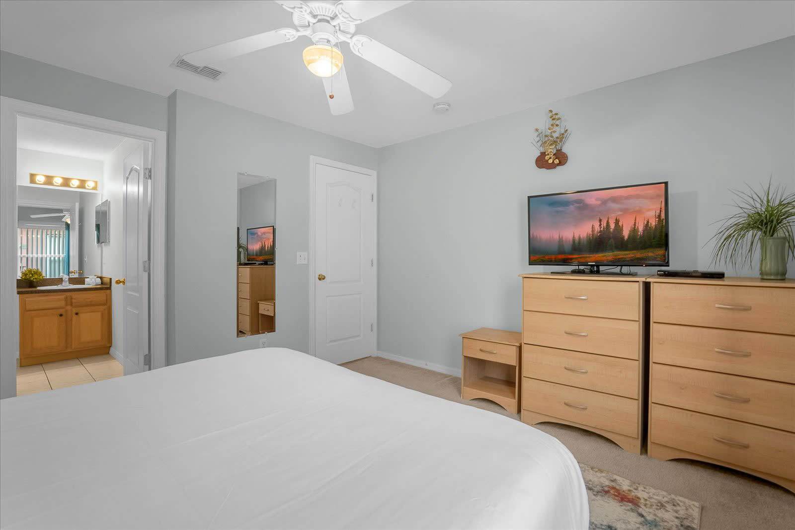 Bedroom With A Queen Bed And Smart TV