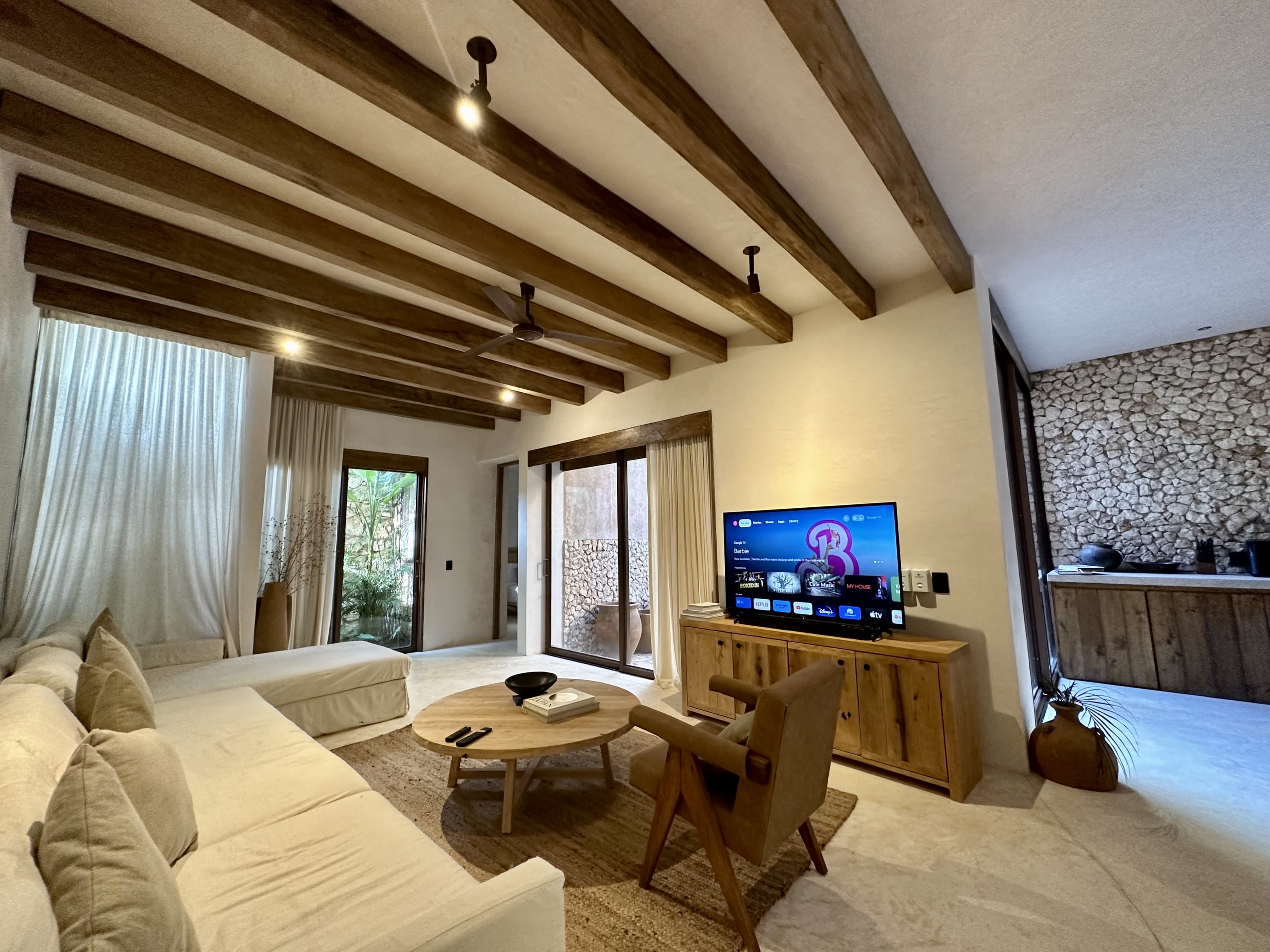 Spacious living room with a TV, located on the ground floor.