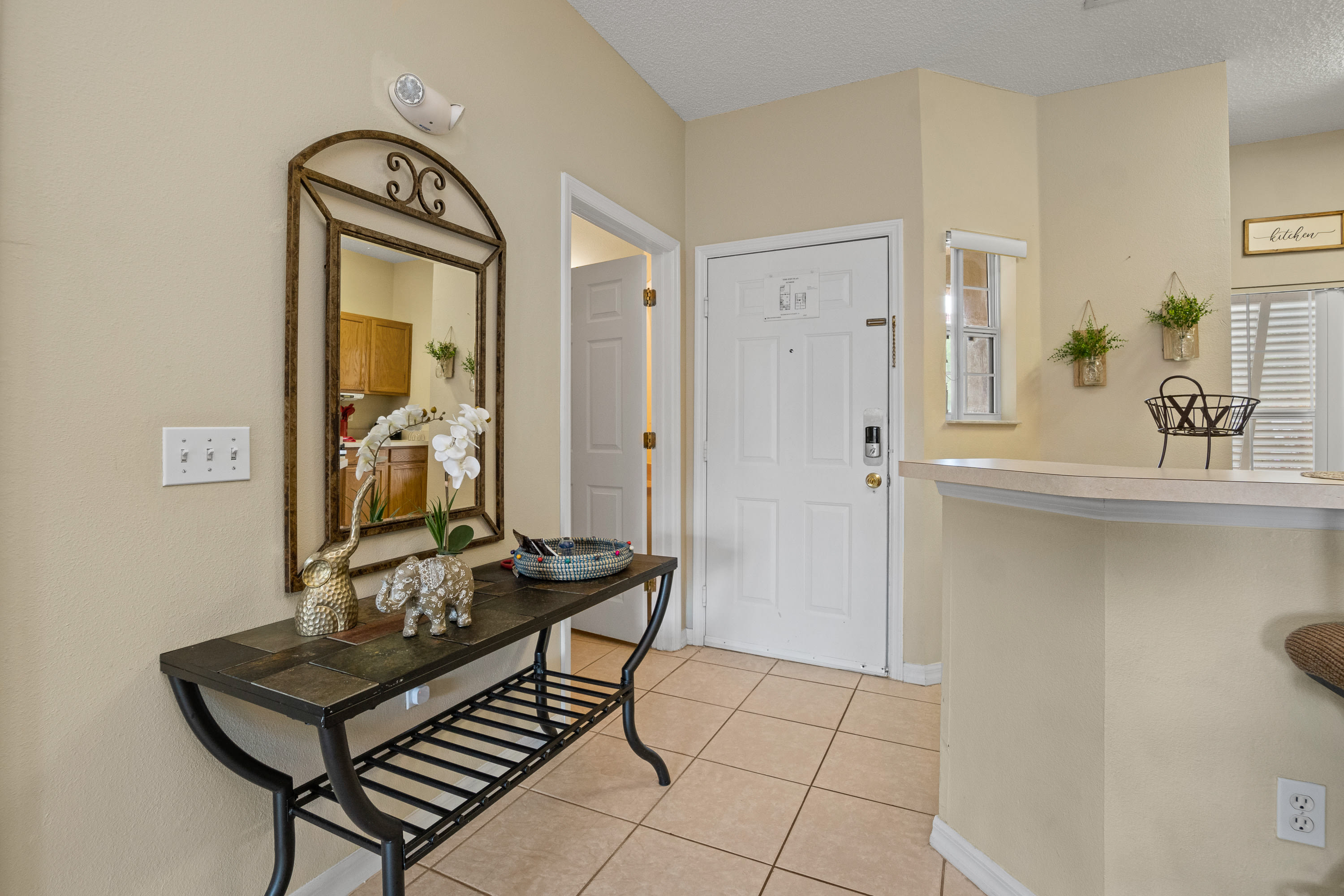 Stylish Entryway With A Charming Mirror And Decor