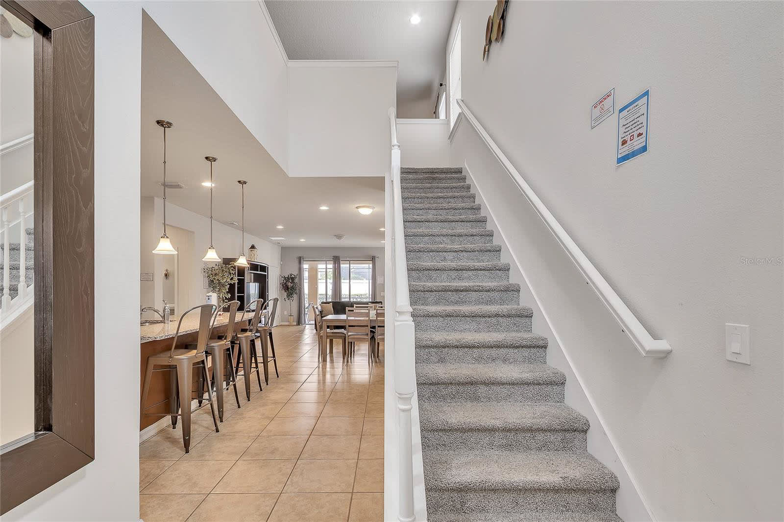 Step Into This Open Concept Home Featuring A Bright Staircase And Modern Design