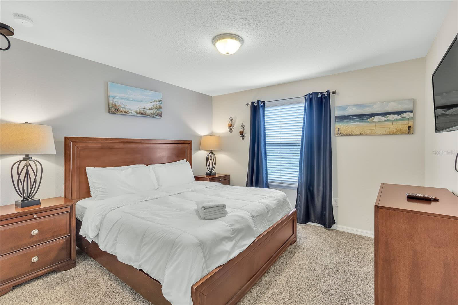 Relax In This Bright Bedroom With Stylish Blue And Wooden Decor