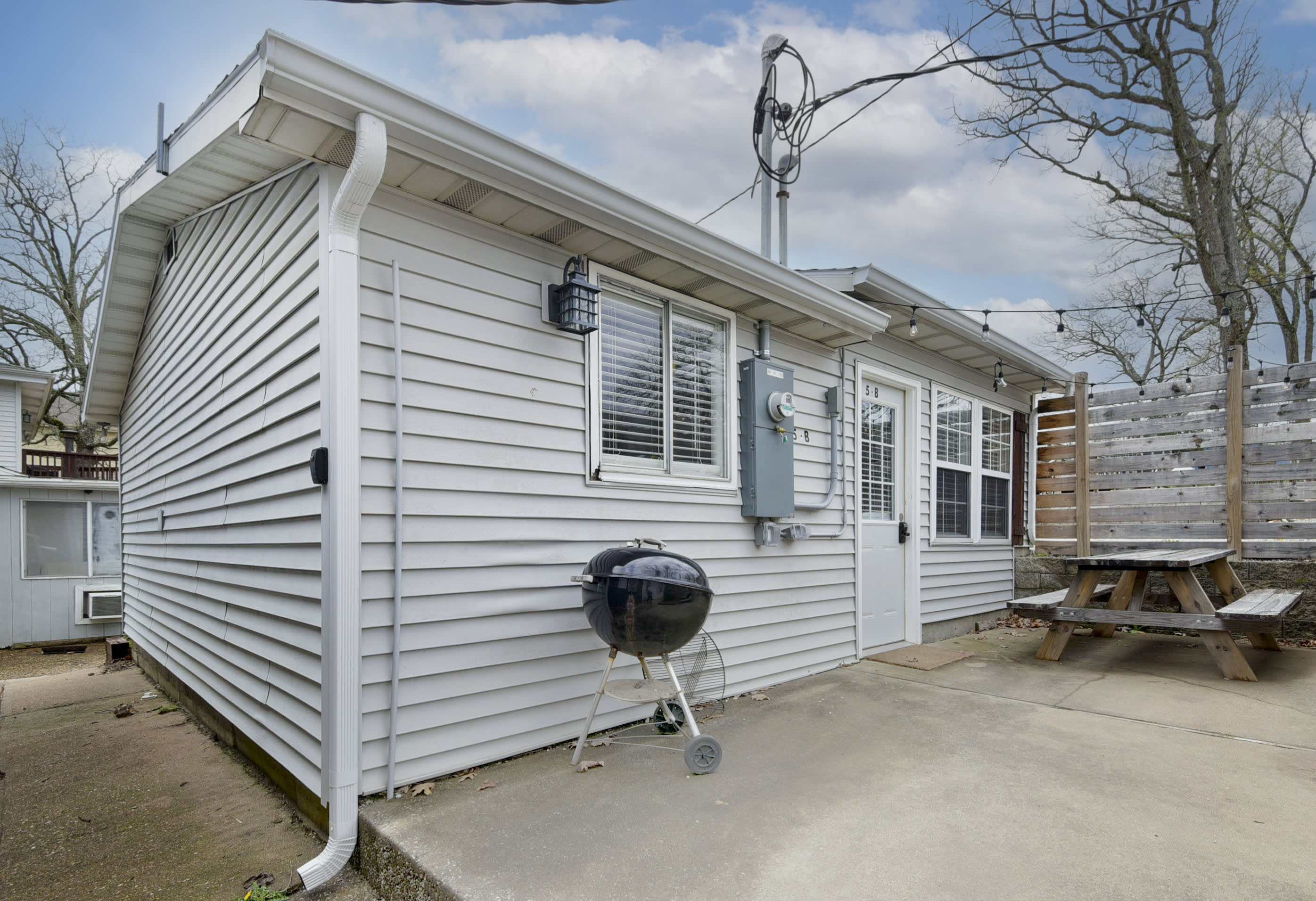 Outdoor area showing the grill and the walkway in front of the cottage.