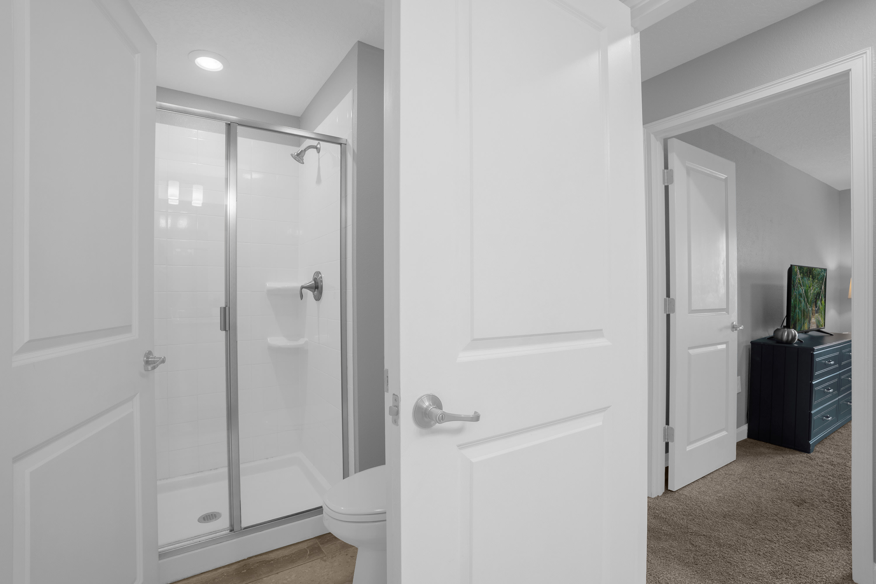 Sleek Bathroom Featuring A Glass-Enclosed Walk-In Shower