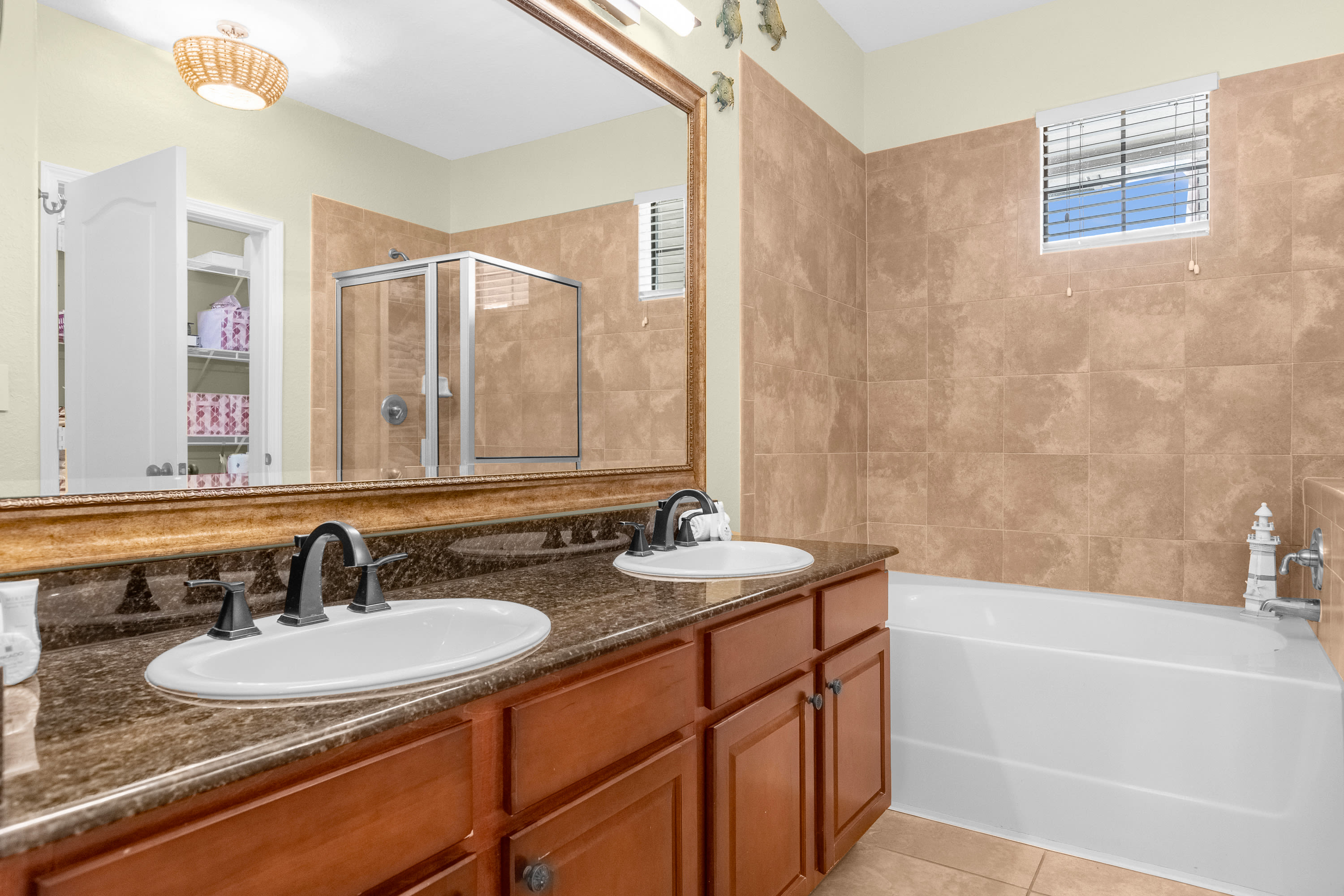 Spacious Bathroom with Double Vanity, Bathtub and Shower