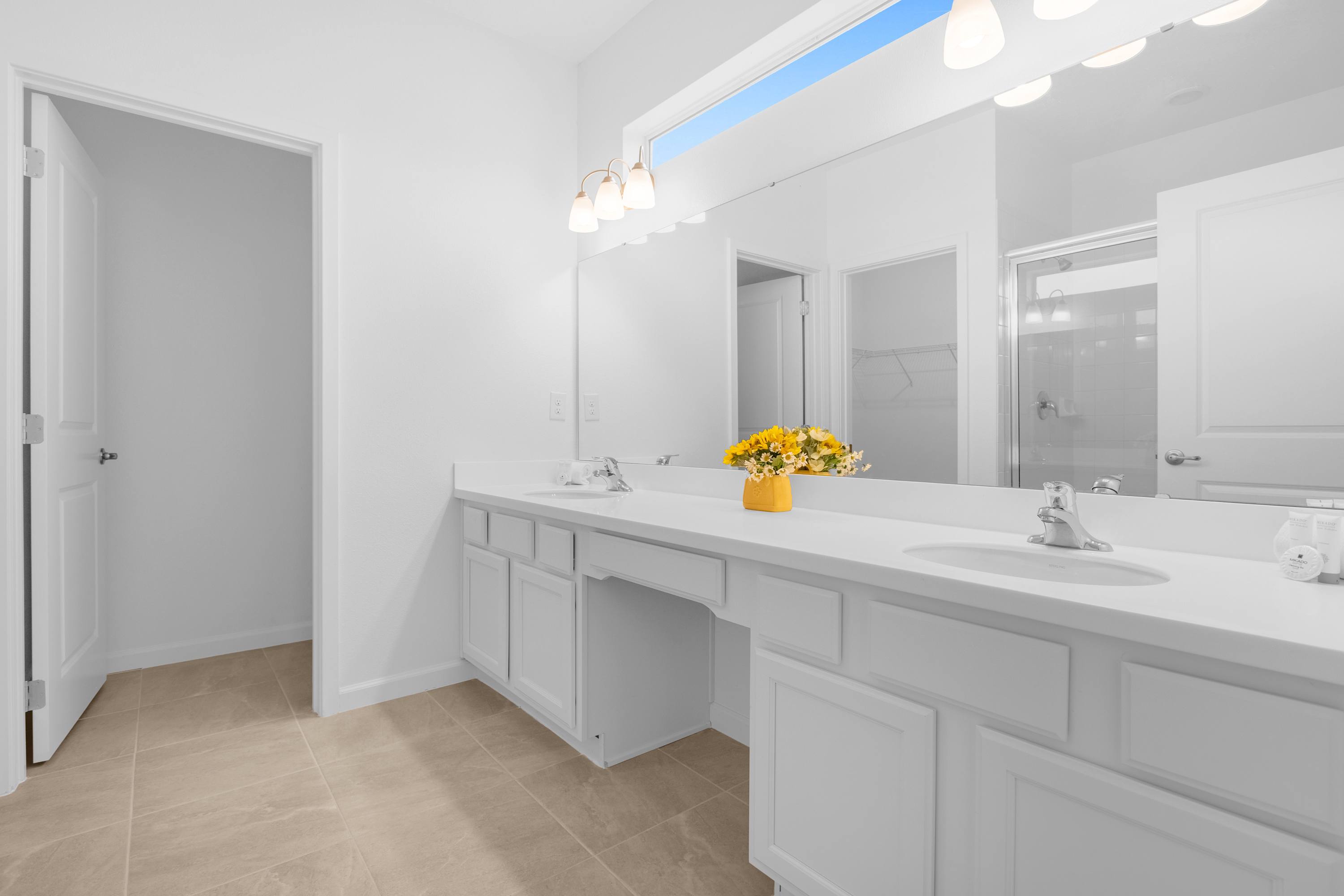 Bright Bathroom With Playful Shower Curtain And Elegant Vanity