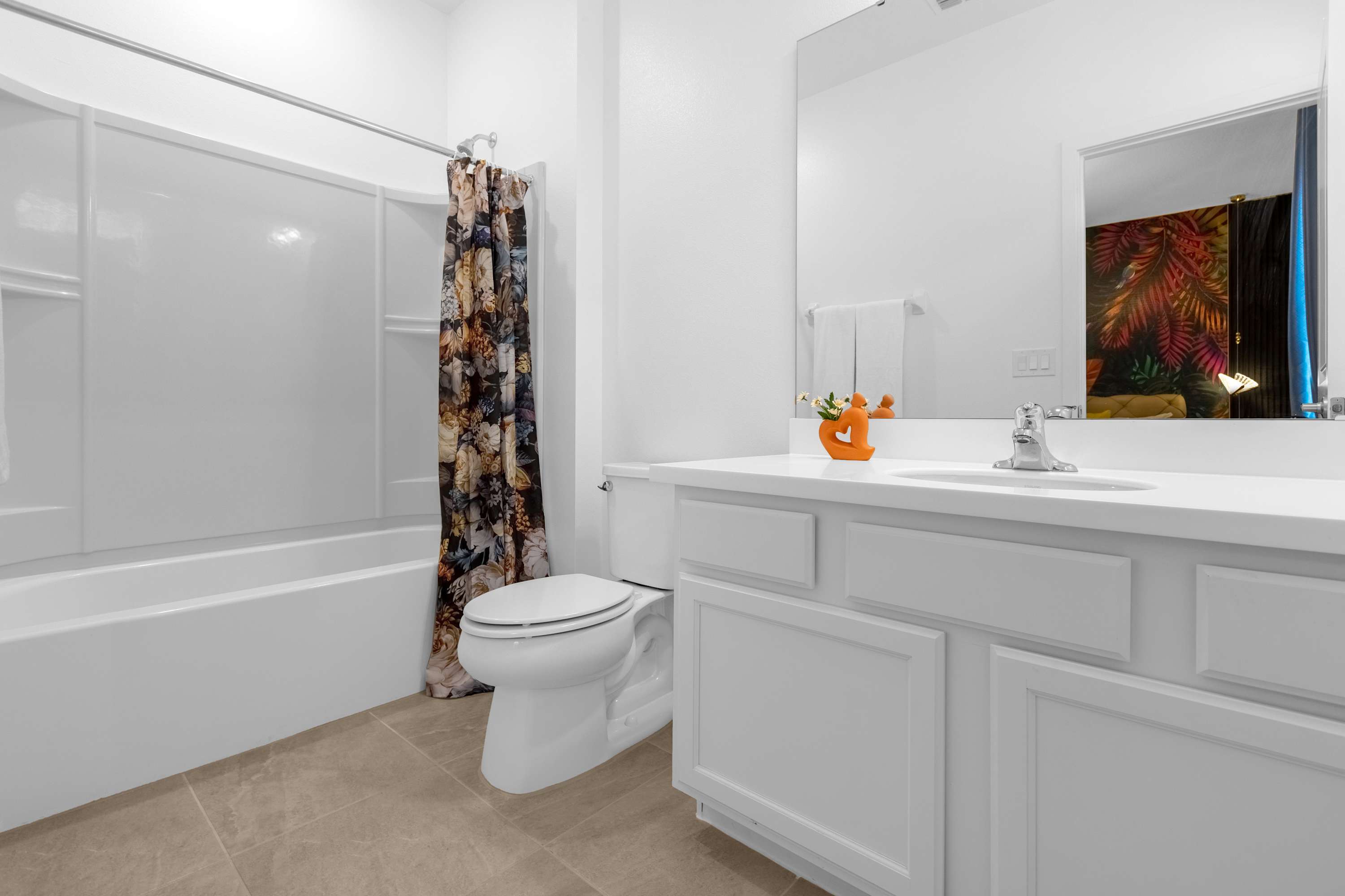 Bright Bathroom With Playful Shower Curtain And Elegant Vanity