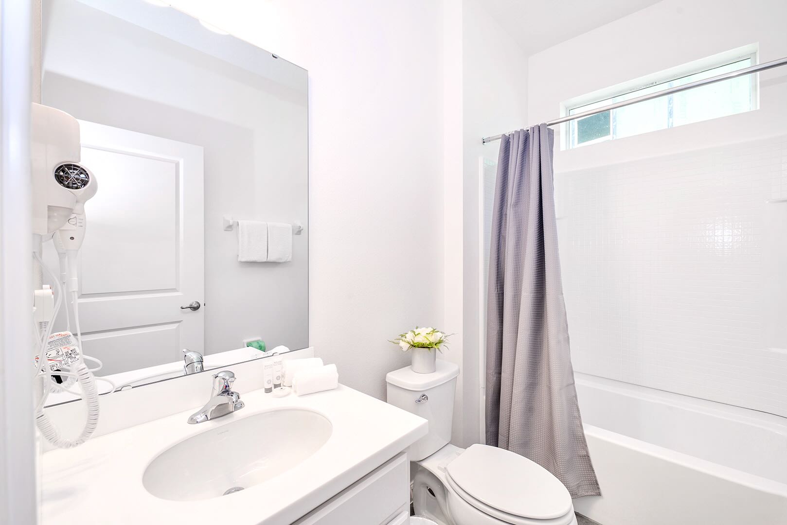 Clean And Bright Bathroom With Tub And Sleek Decor