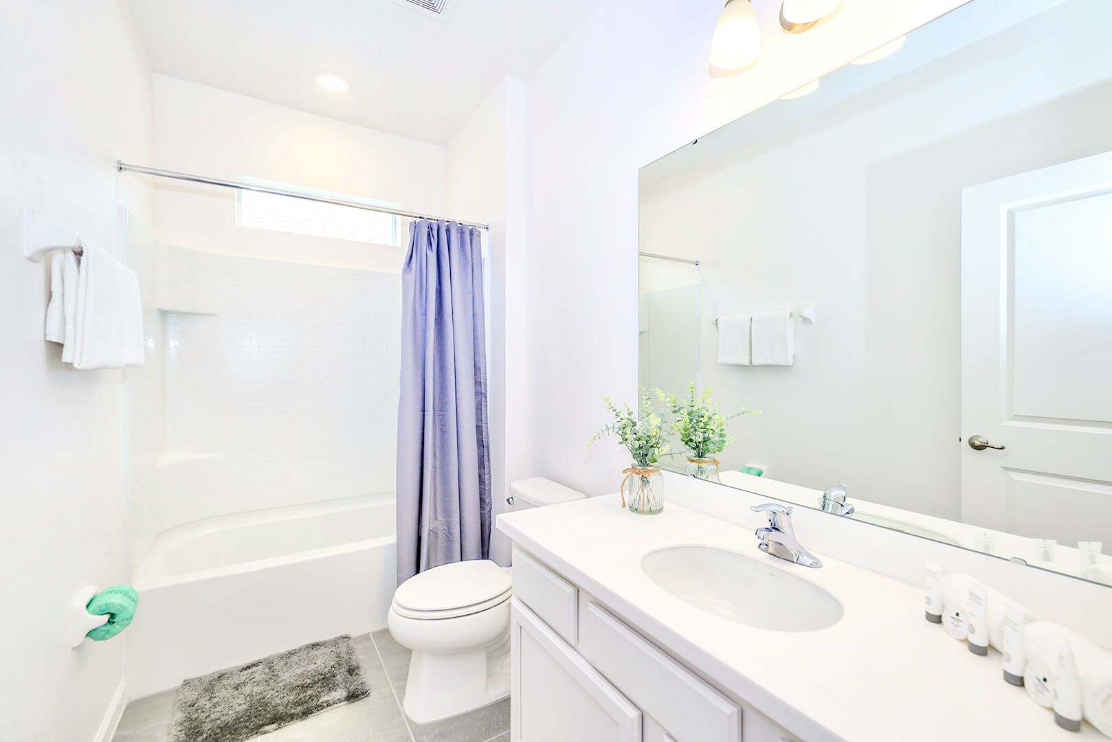 Modern Bath Featuring Bright Fixtures And Relaxing Tub