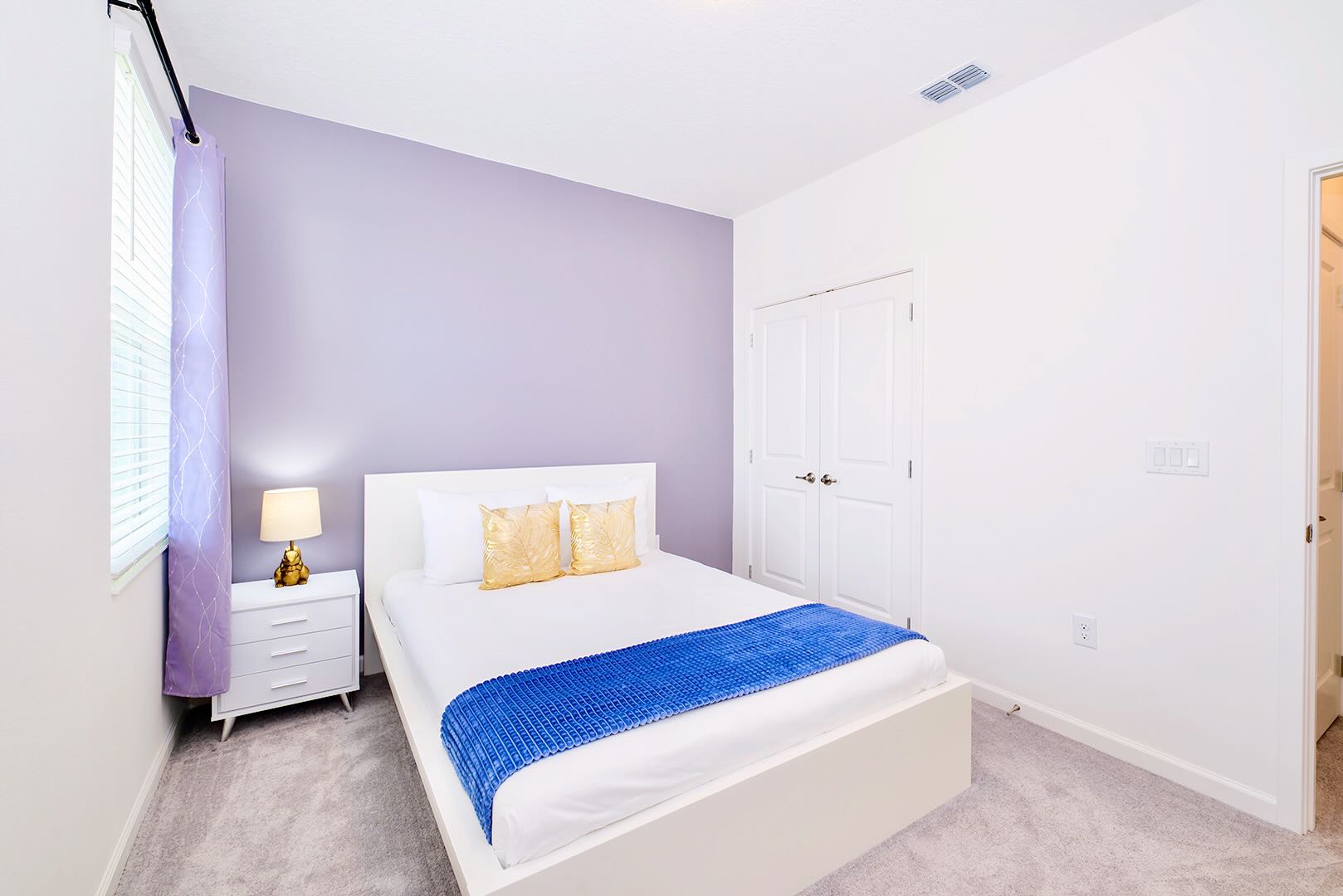 Elegant Room Featuring Comfortable Queen Bed And Soft Colors