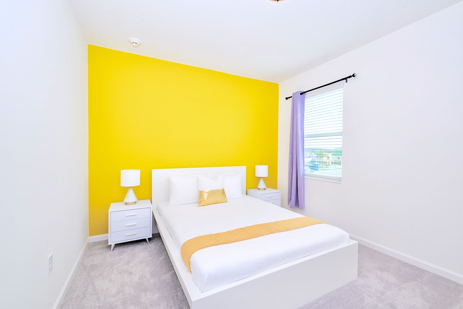 Stylish Room Featuring Queen Bed And Cheerful Colors