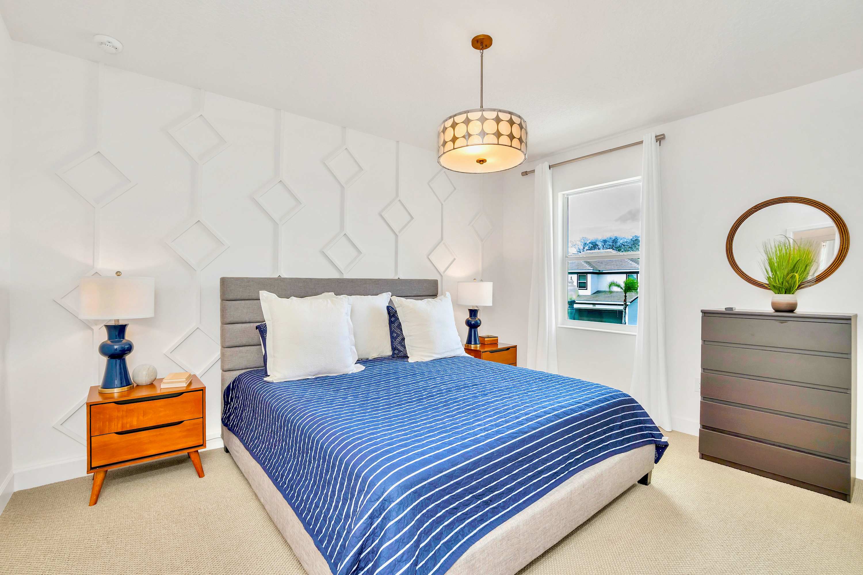 Elegant Bedroom Featuring A Comfortable King Bed With Stylish Accents