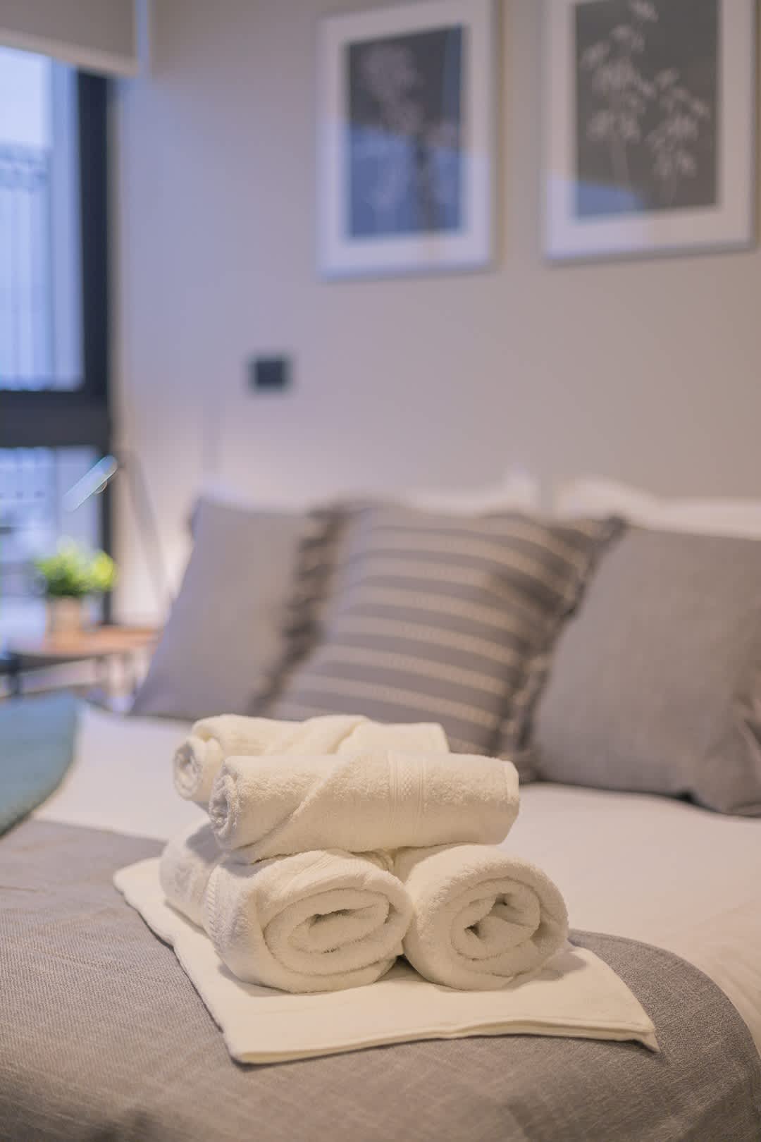 Relax in this cozy studio with plush bedding and a welcoming ambiance, perfect for a restful stay.