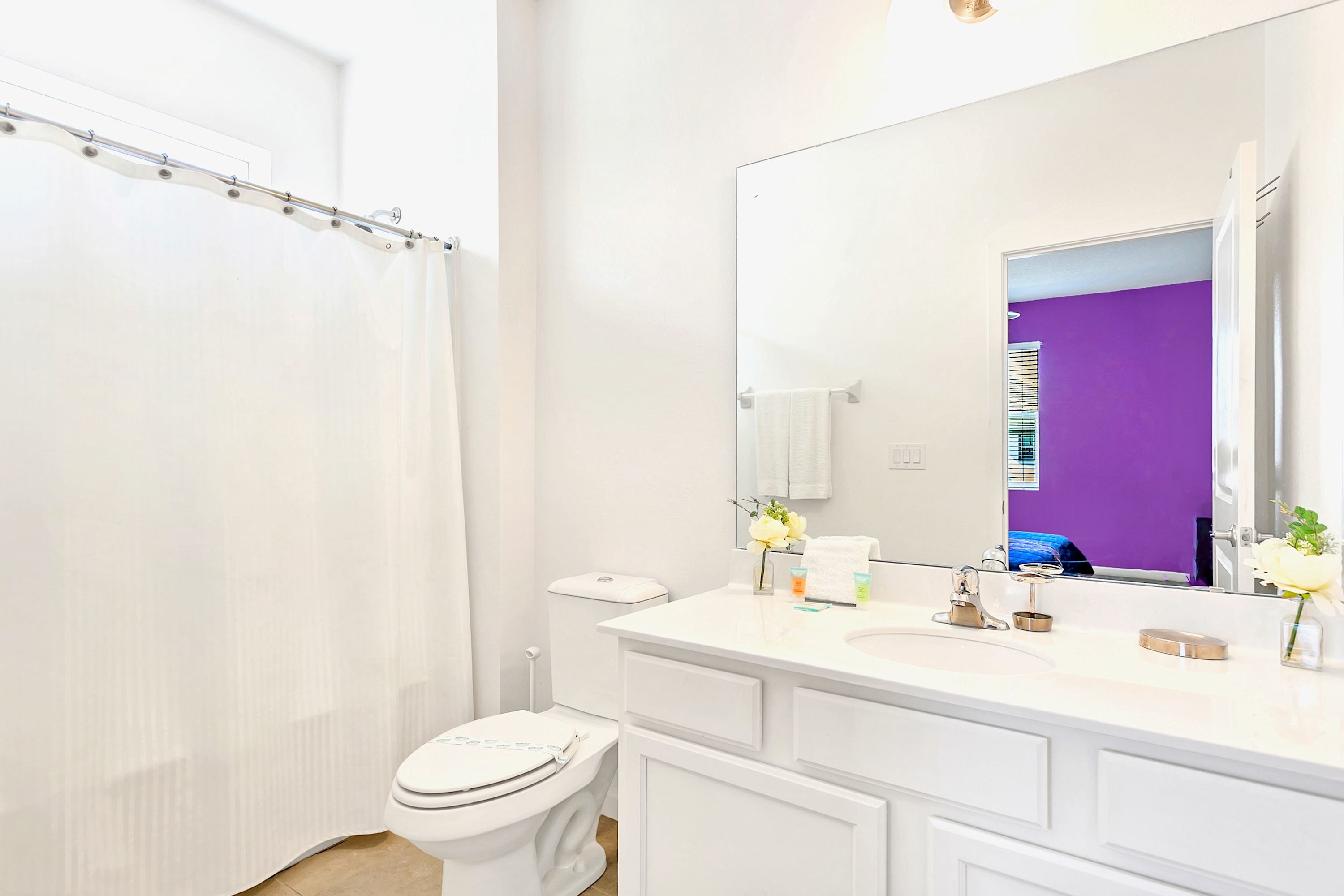Modern Bathroom With Tub Shower Combo And Bright Lighting