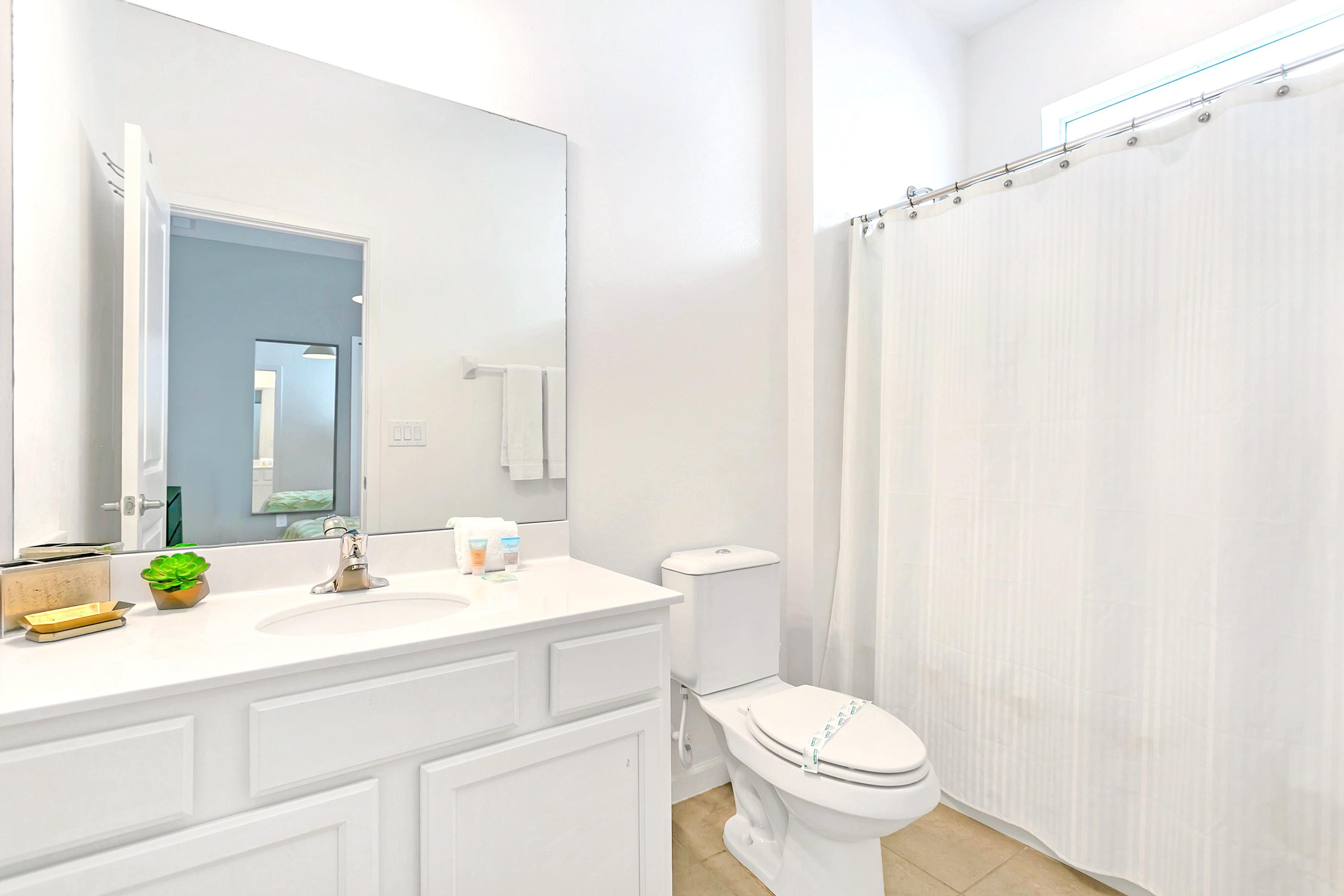 Modern Bathroom With Shower Tub Combo And Bright Lighting