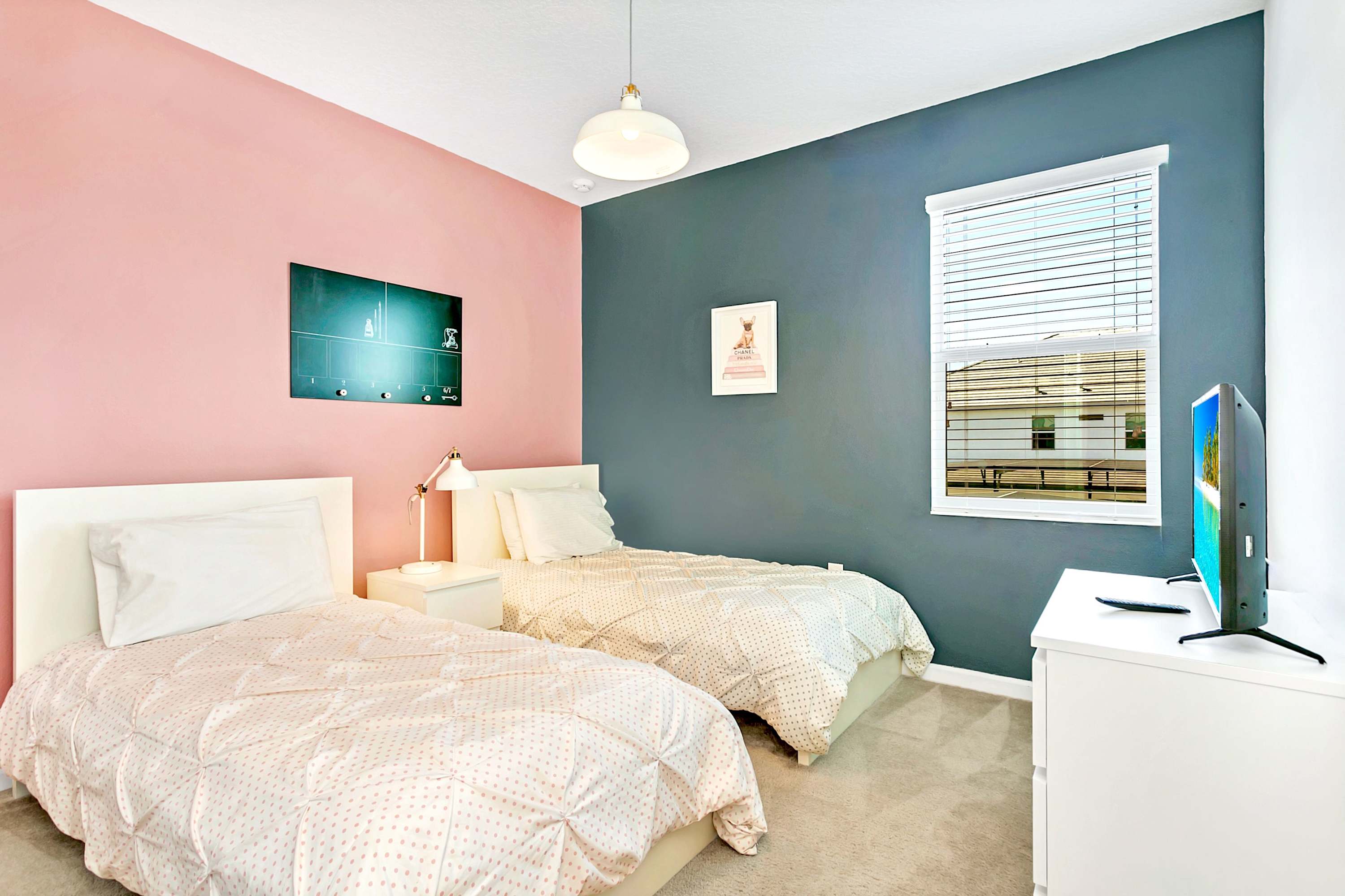 Neutral Twin Bedroom With Modern Decor And Large Windows