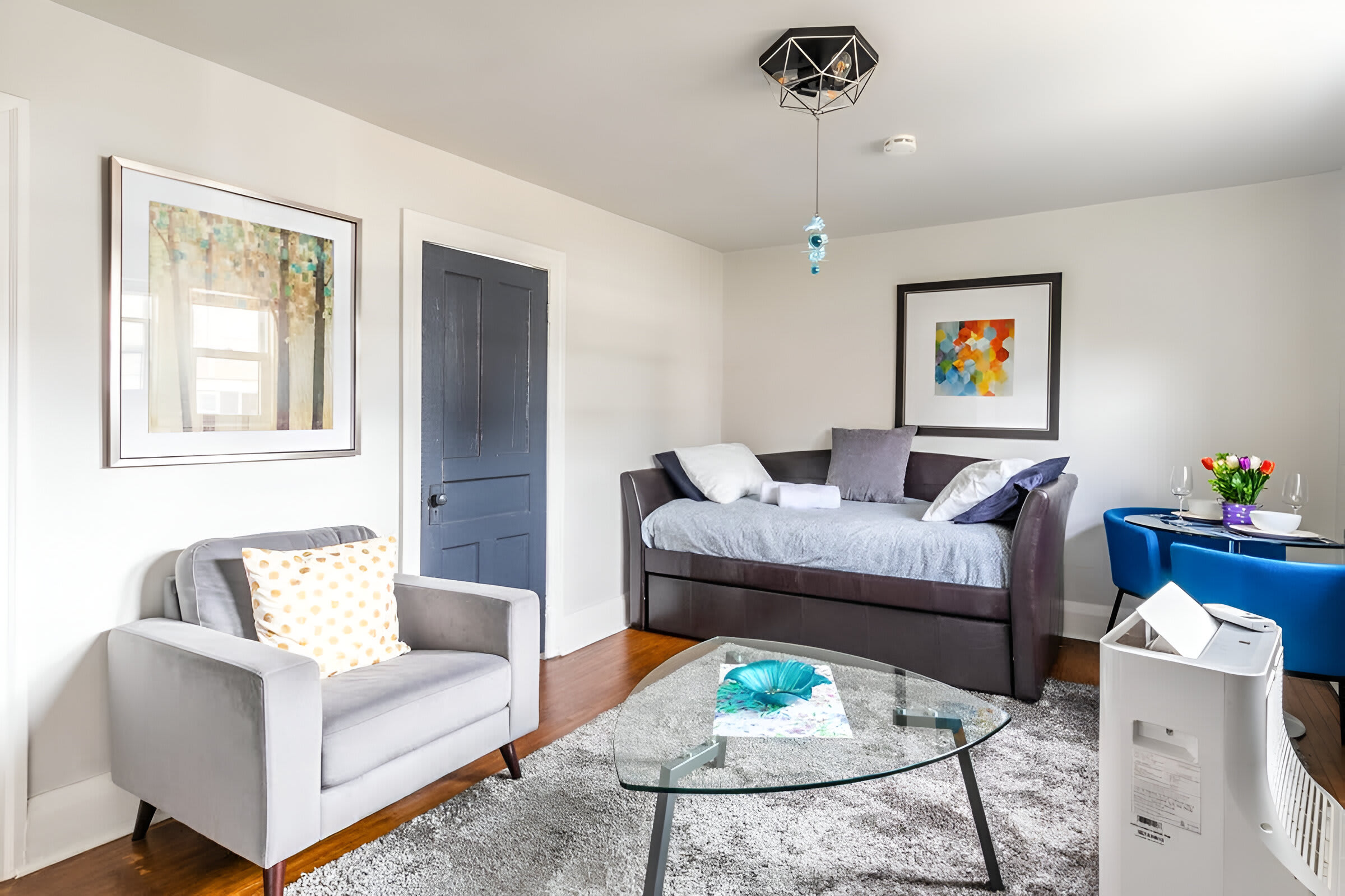 Spacious Sitting Area With Modern Daybed And Art Decor
