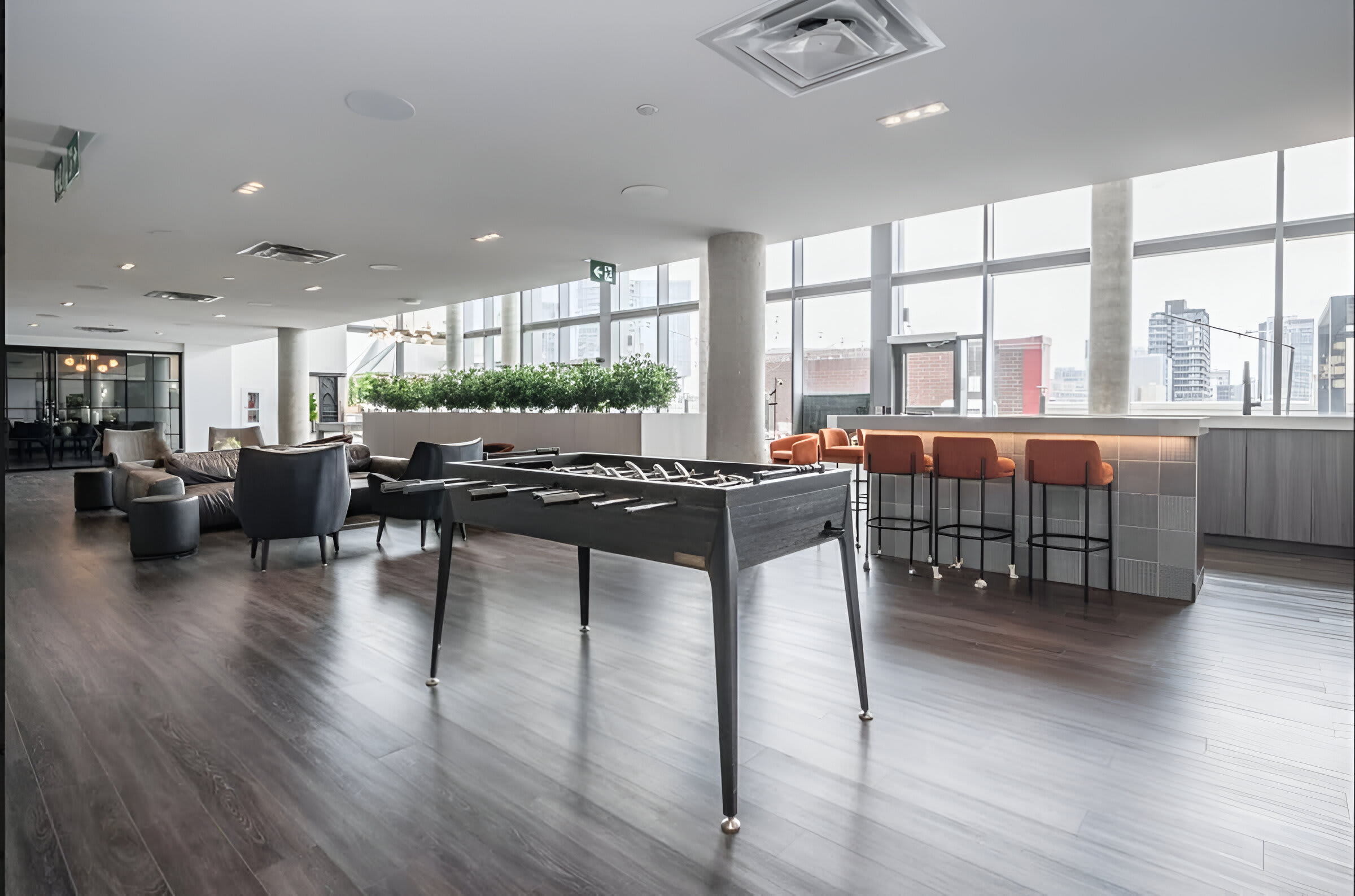 Lounge With Foosball Table And Seating Area For Social Gatherings