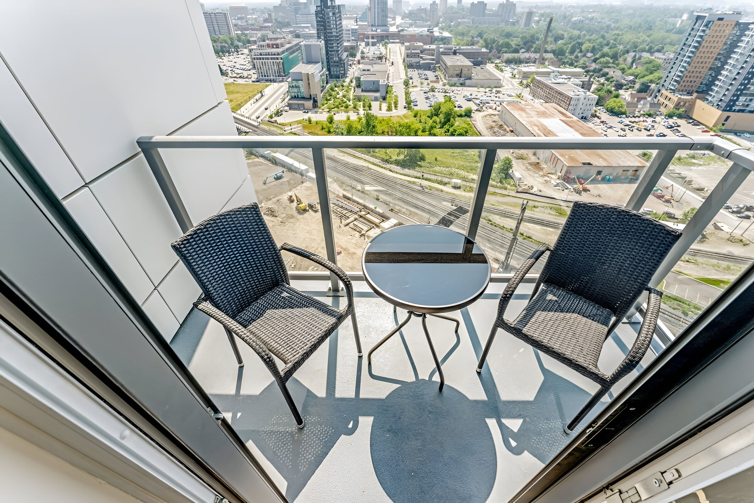 Cozy Balcony Space Perfect For Morning Coffee And Scenic City Views