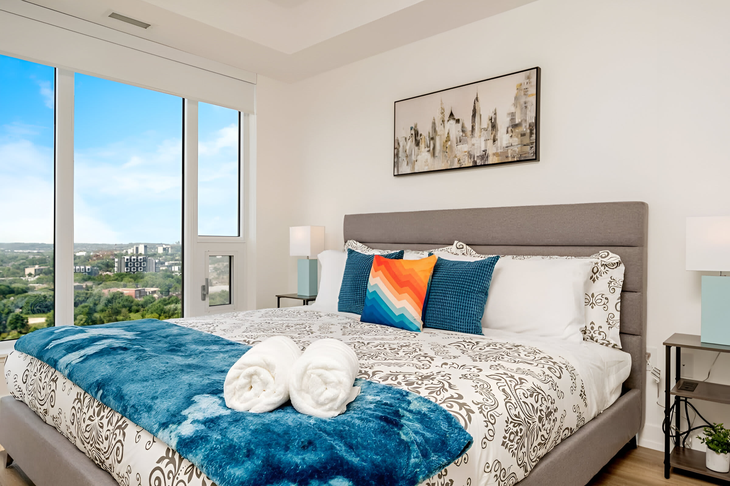 Spacious Bedroom Featuring A King-Sized Bed And Stunning Window Views