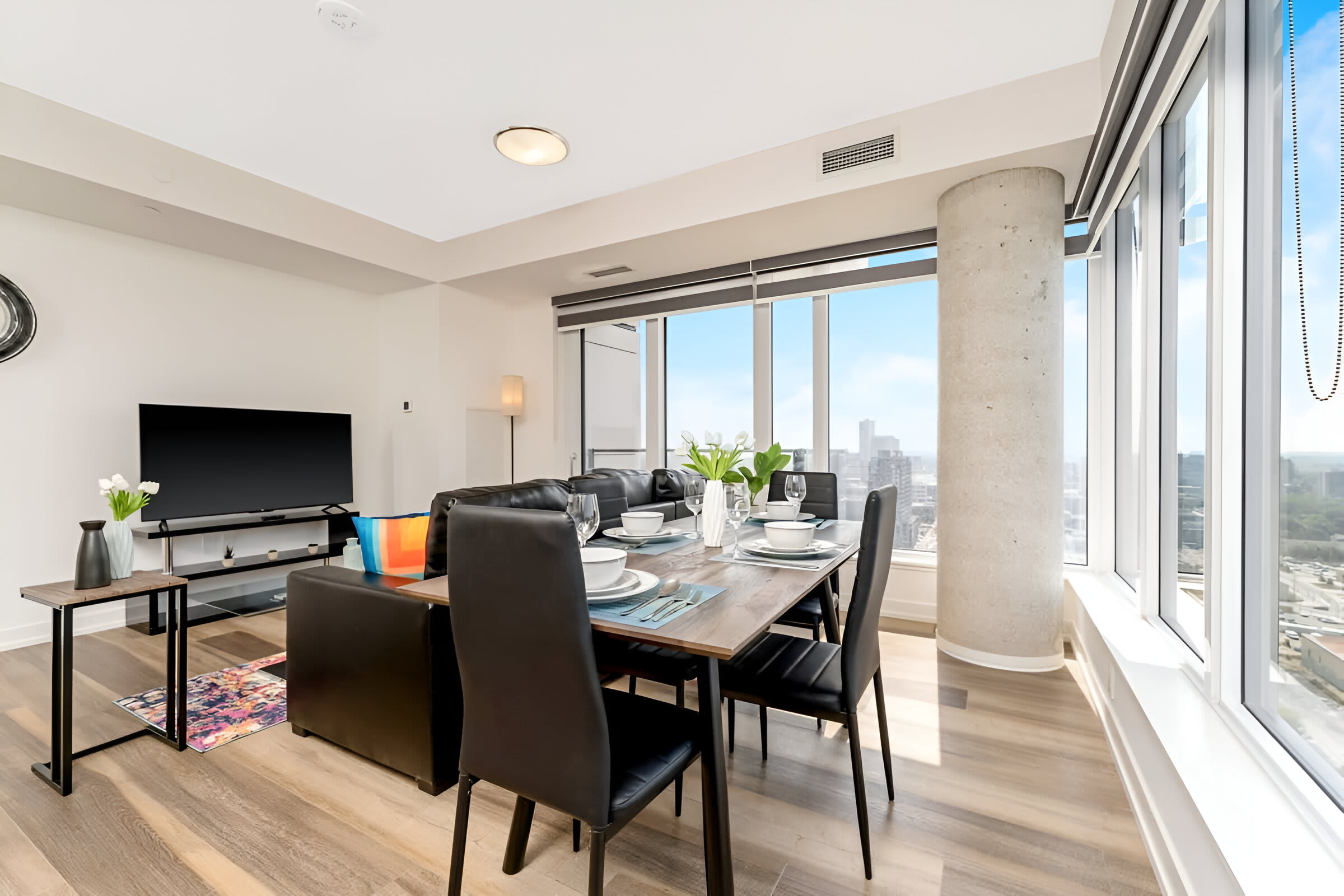 Stylish Living And Dining Space Featuring Modern Furniture And Gorgeous Views