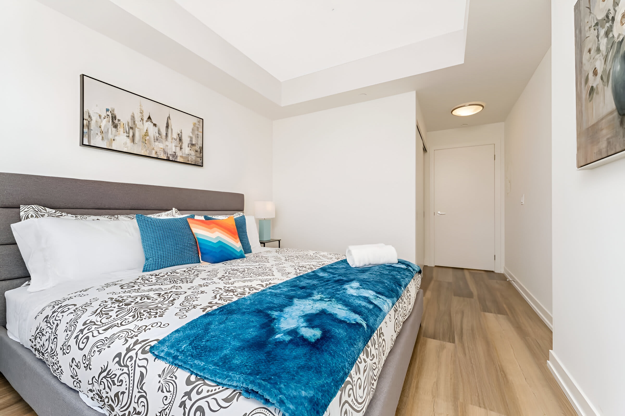 Second Bedroom Showcasing Elegant Décor And A Comfortable King-Sized Bed