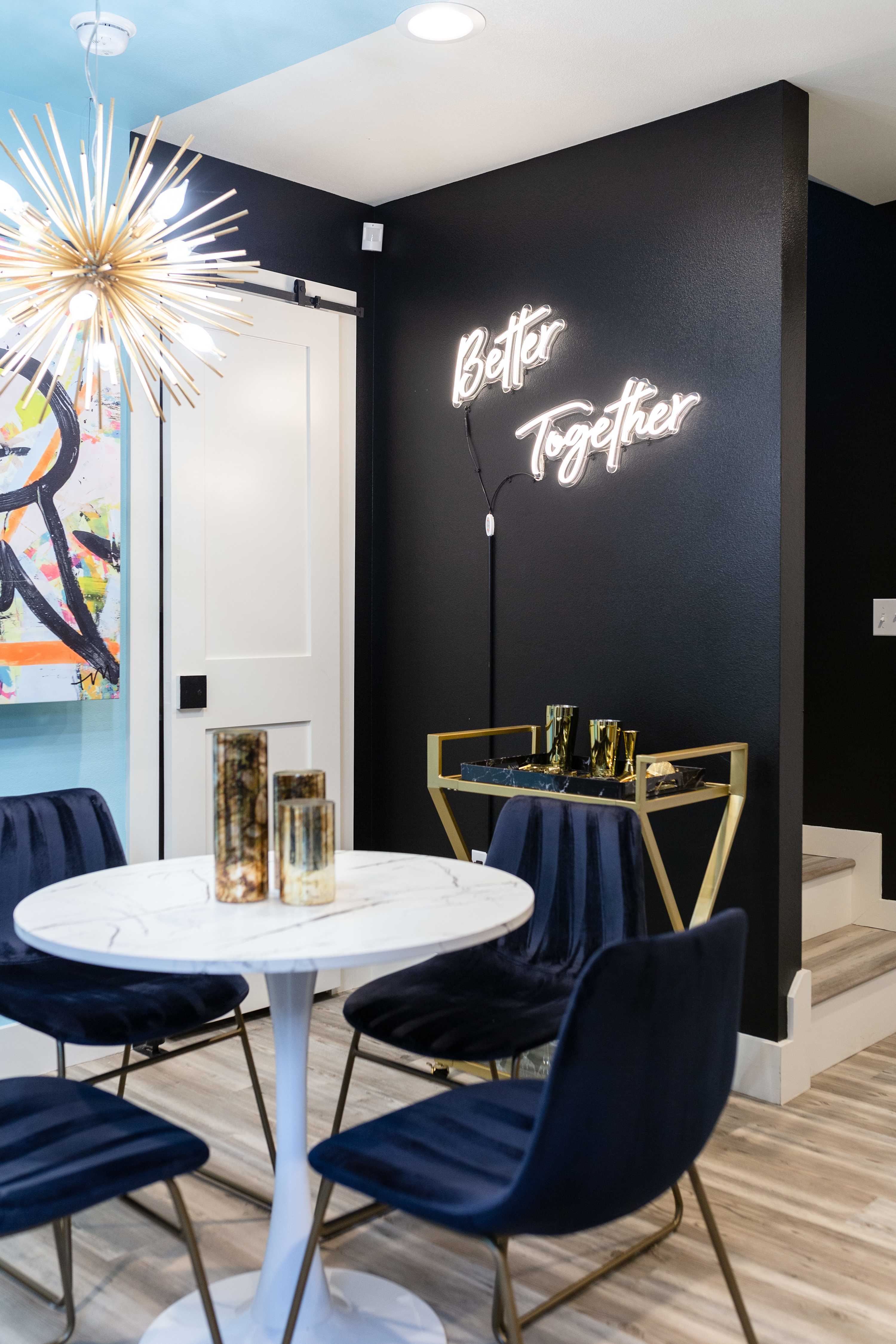 Elegant Dining Corner With Gold Finishes And Neon Lighting