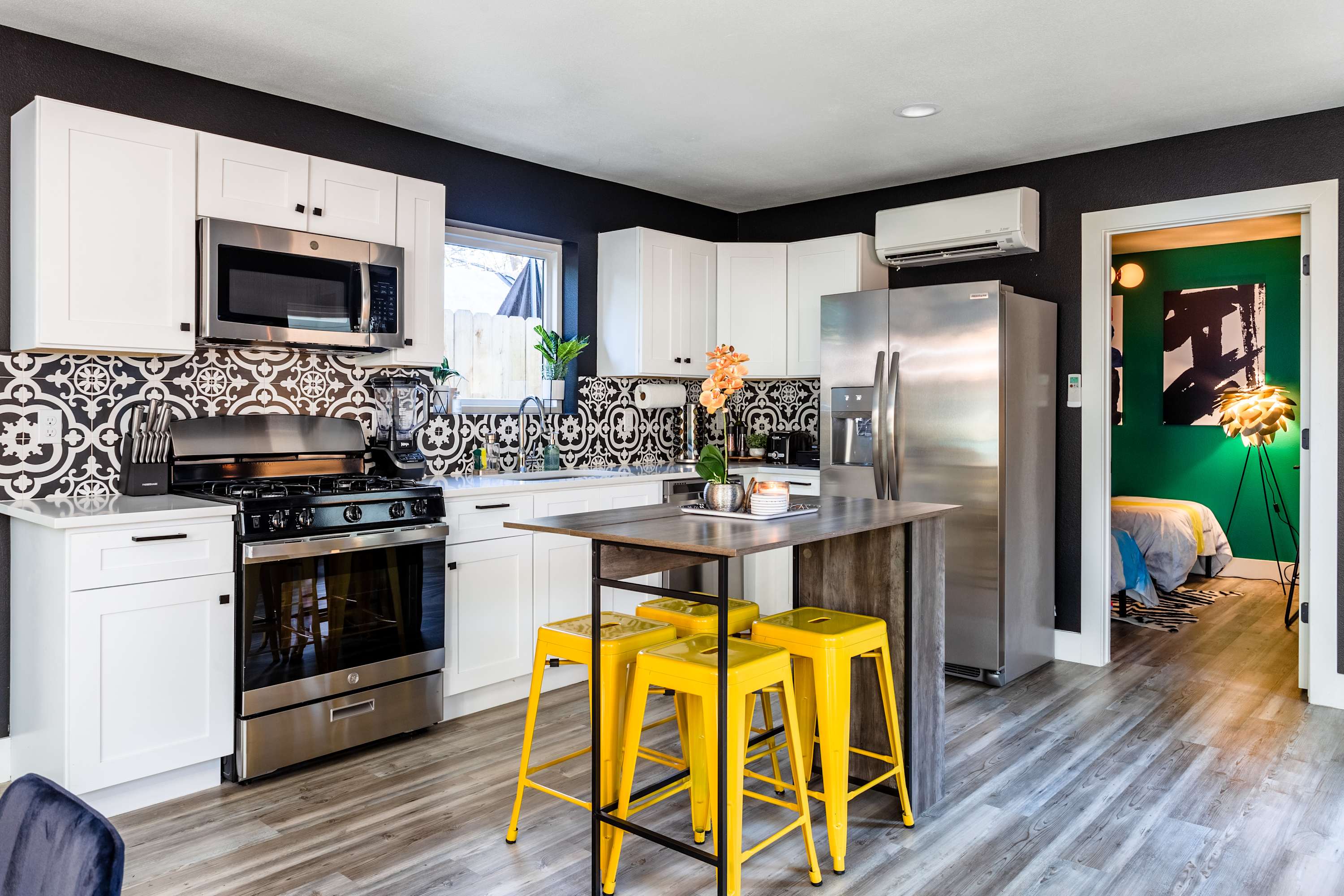 Modern Fully-Equipped Kitchen With Stylish Backsplash And Central Island