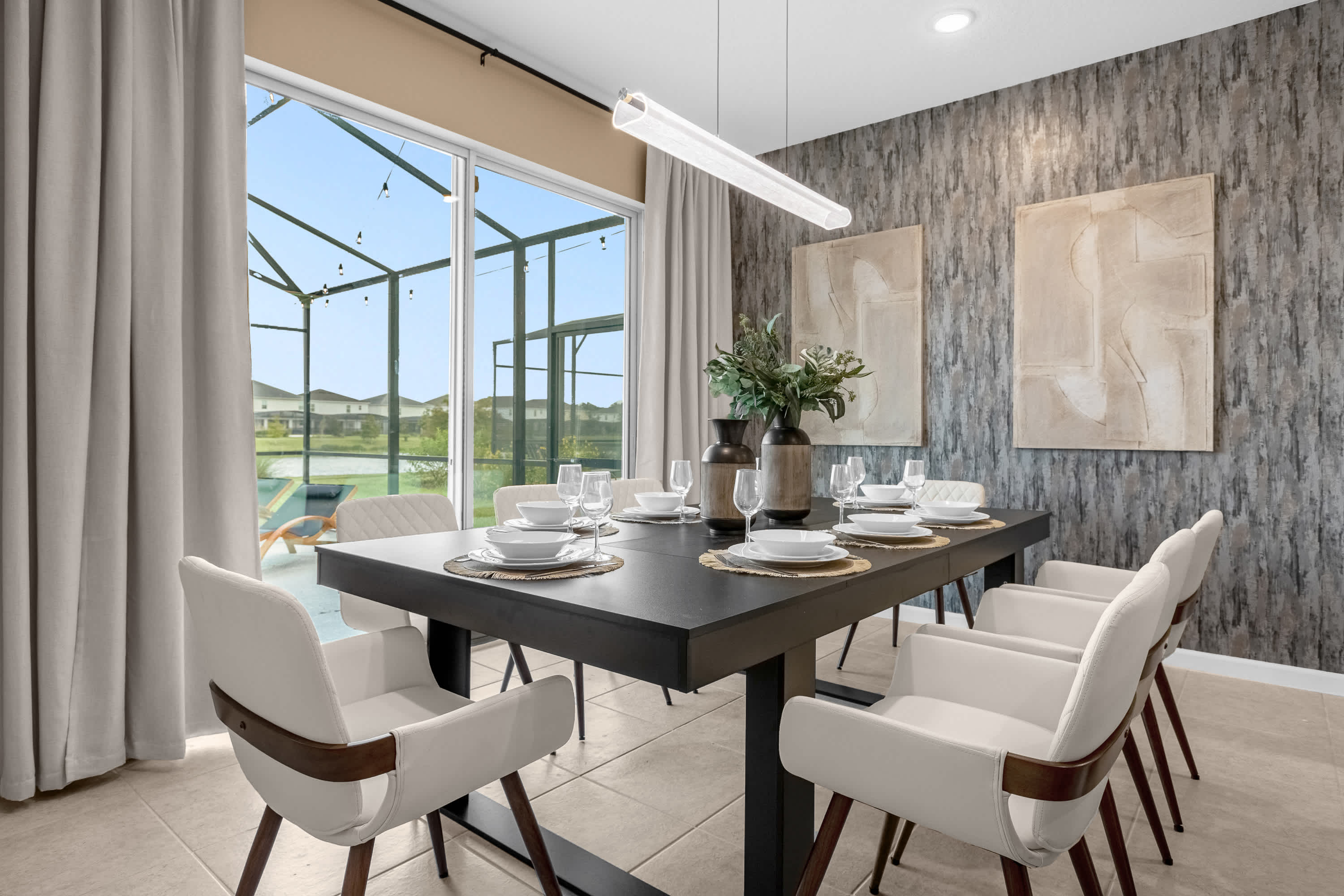 Stylish Dining Table Set For Eight, Overlooking The Spacious Open-Concept Kitchen