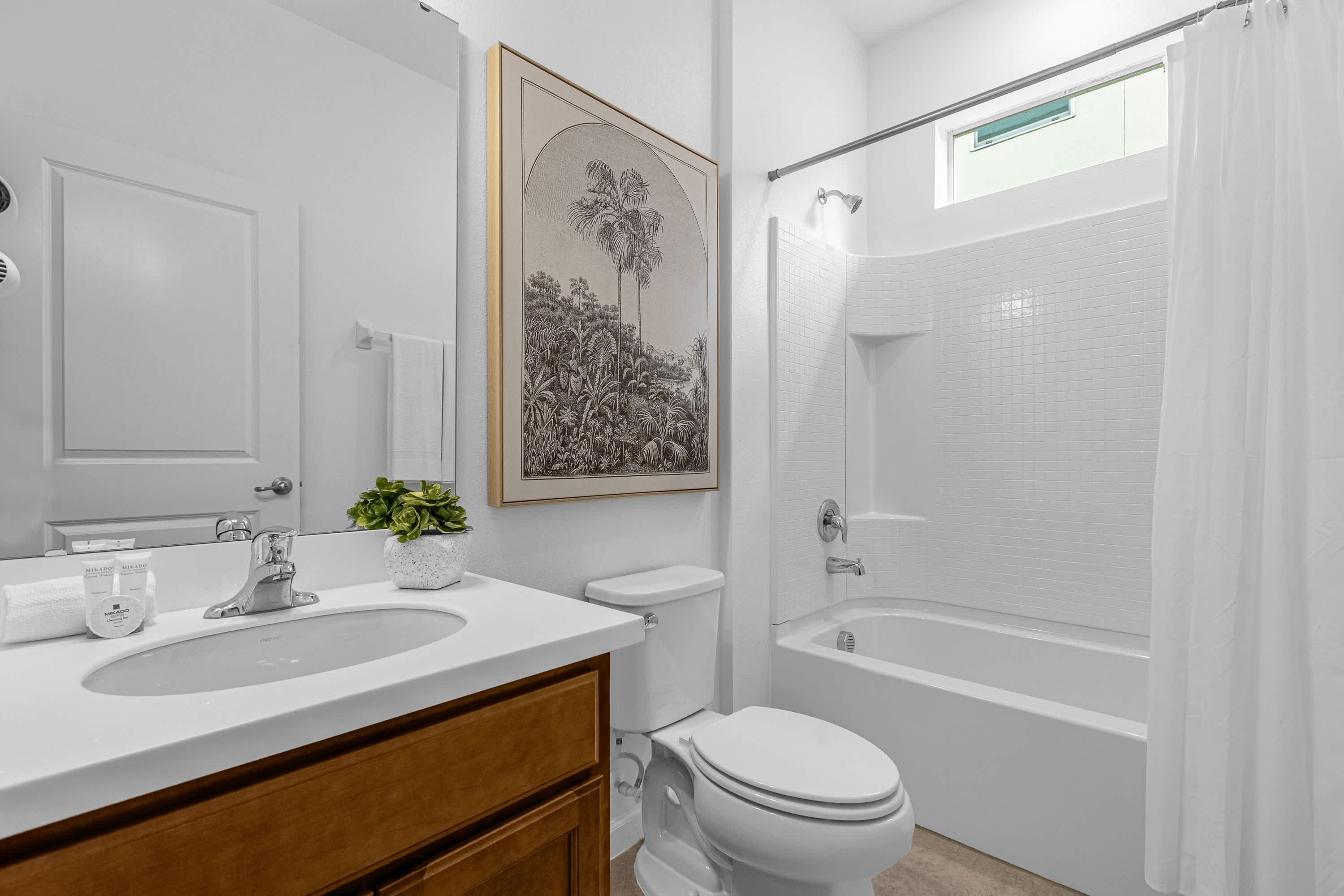 Modern Bathroom Featuring A Tub And Minimalist Design