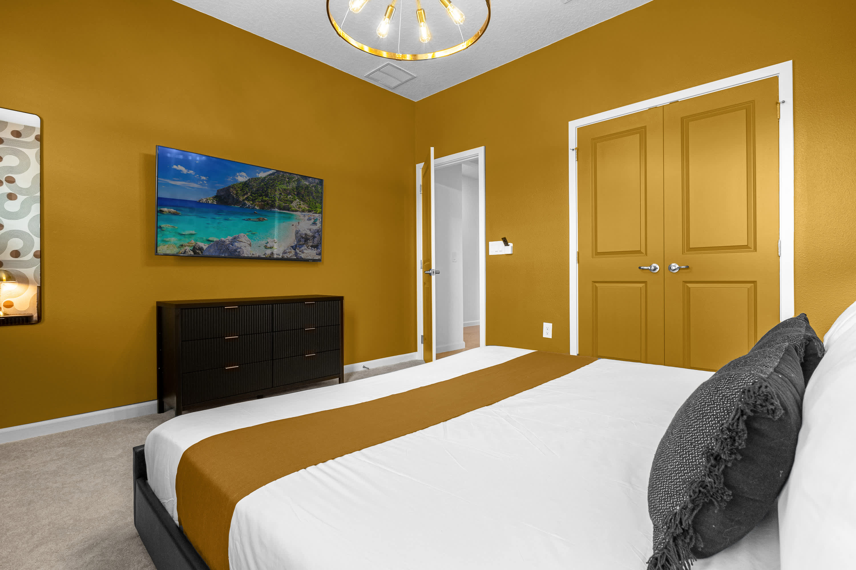 Elegant Bedroom With A Golden Accent Wall And Modern Design